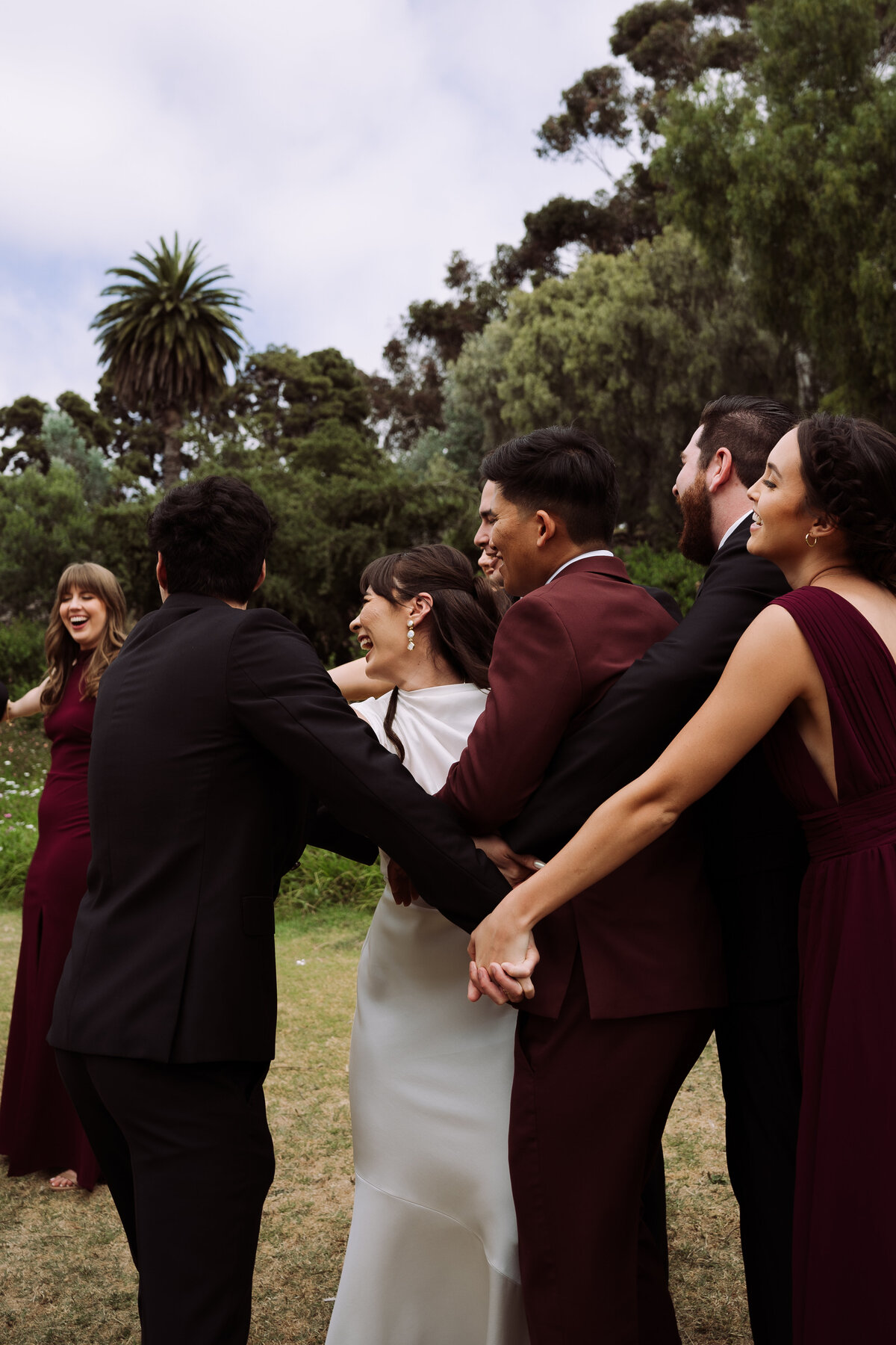 happy wedding party laughing