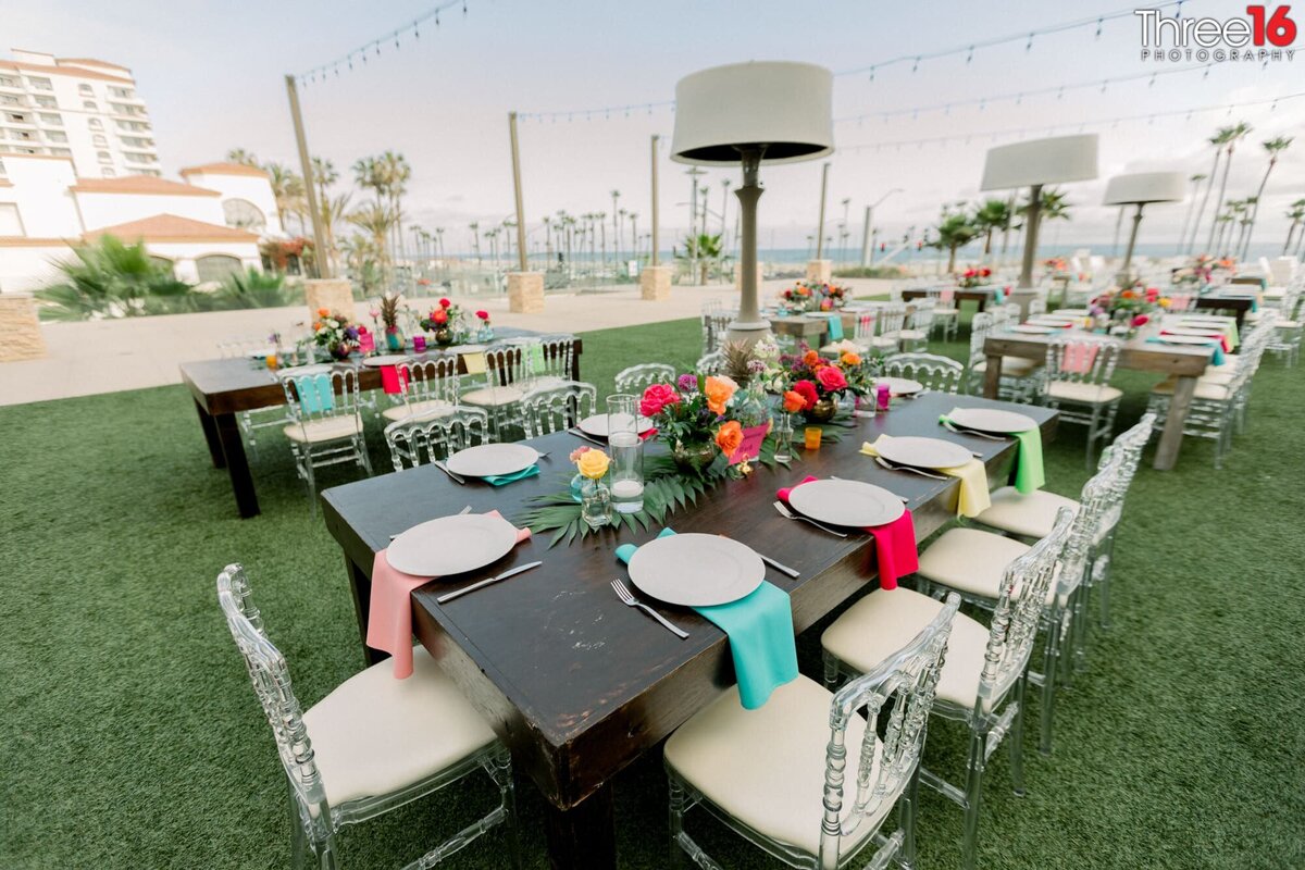 Tables set up for dinner reception on top of the Pasea Hotel in Huntington Beach