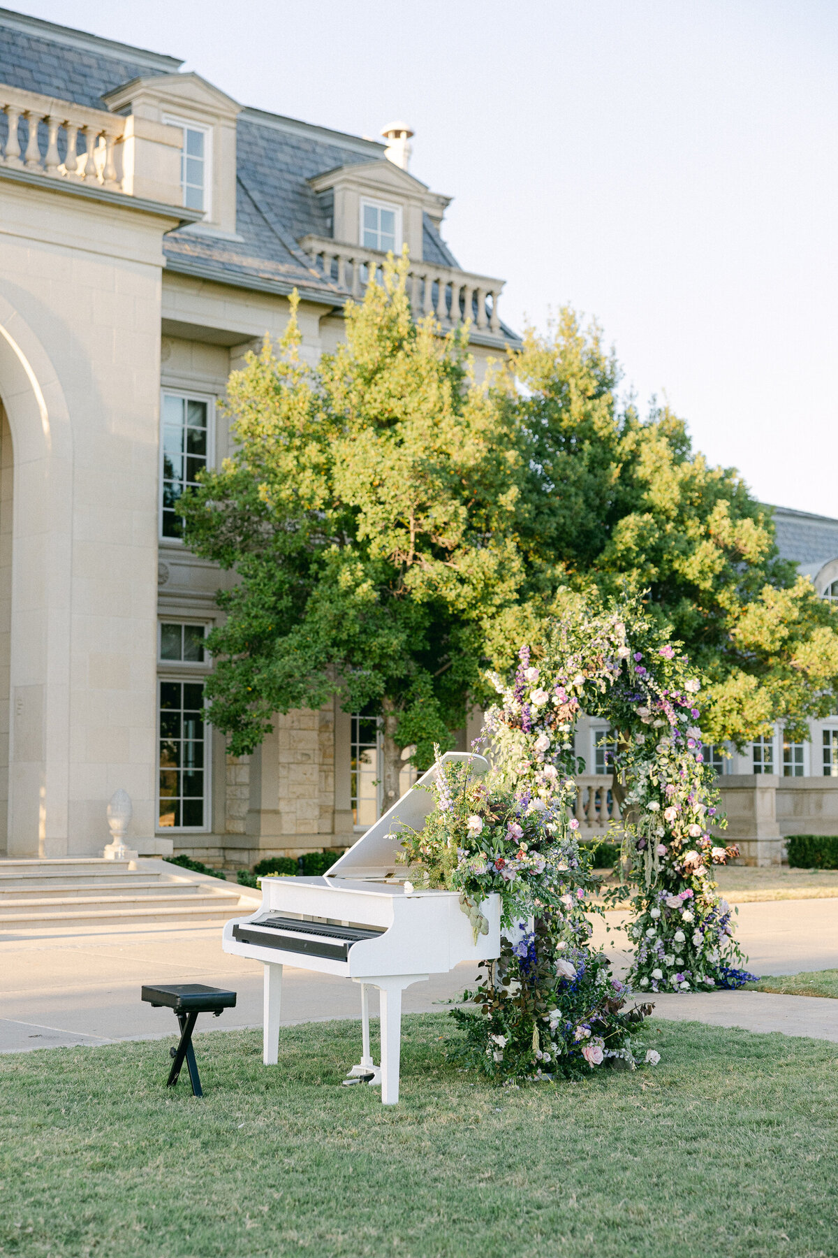 the lawn of an extravagant wedding venue