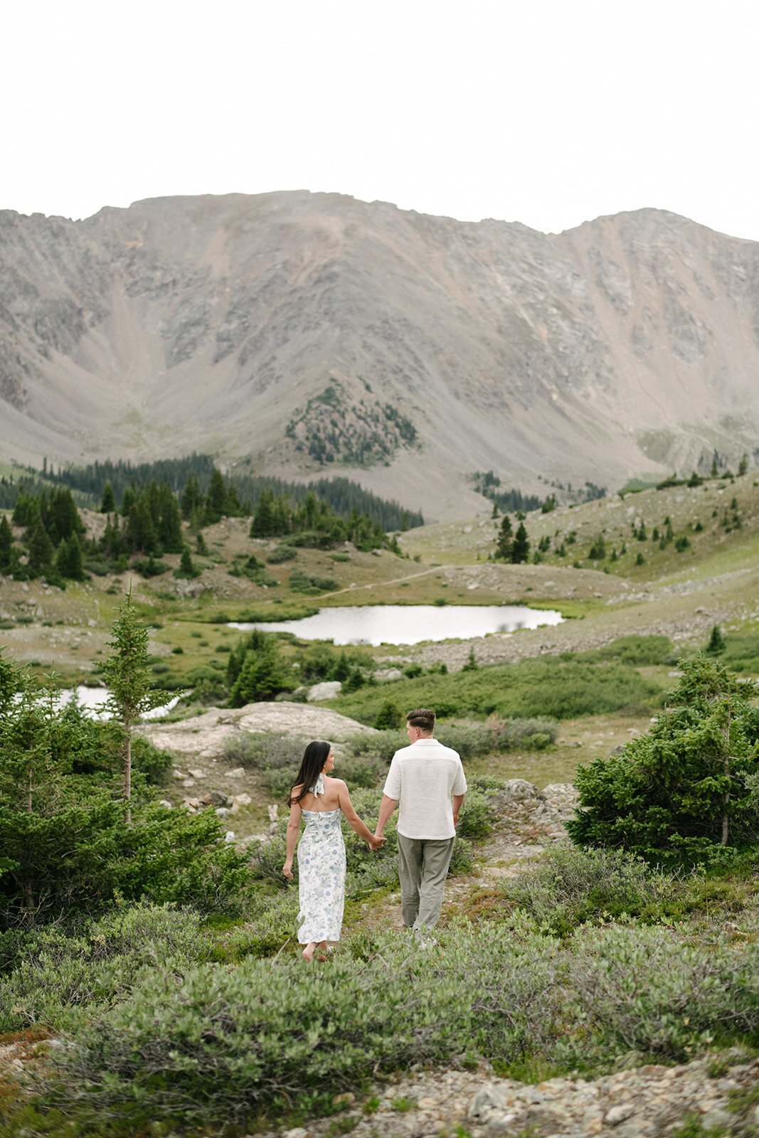 Denver engagement photographer capturing couple hiking in the mountains