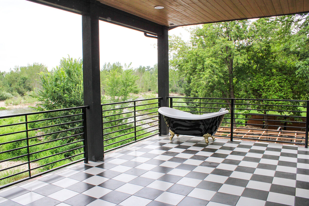 large balcony with black and white checkered floor
