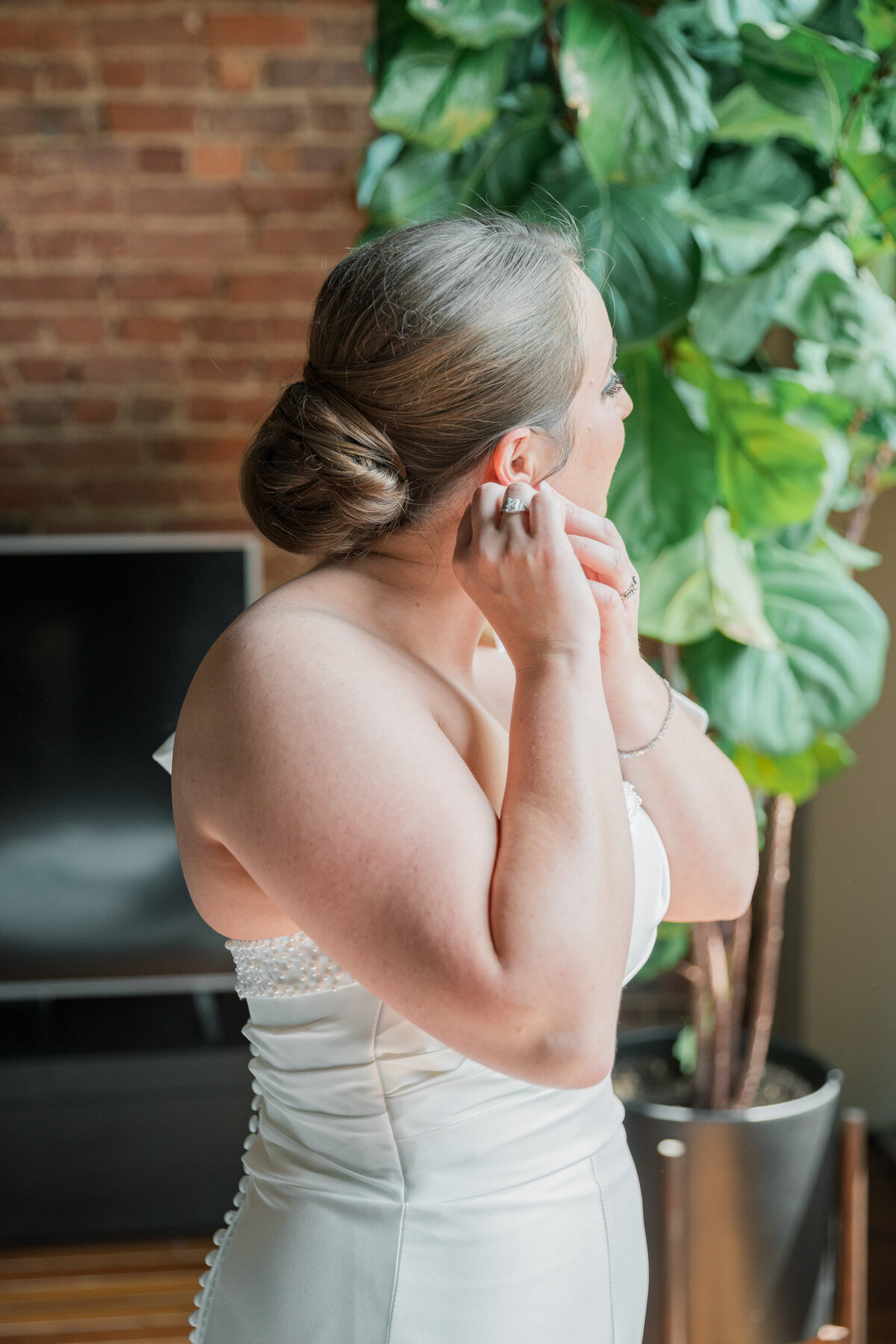 Bristol Train Station Wedding | bride adjusts her earrings