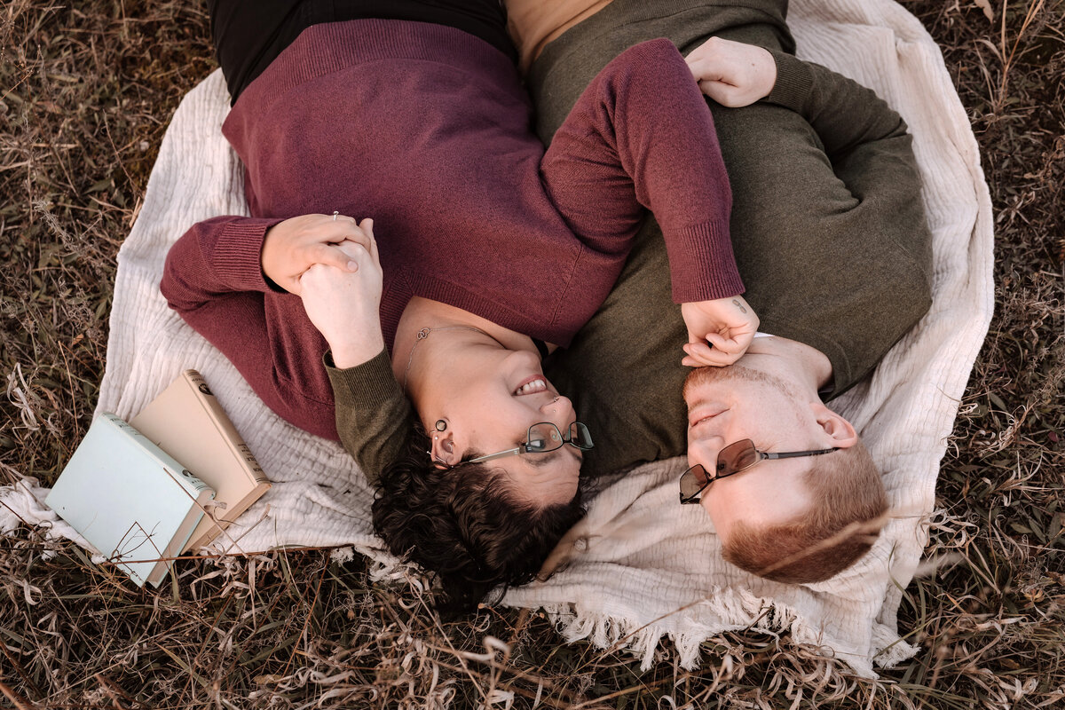 Couple laying on a blanket