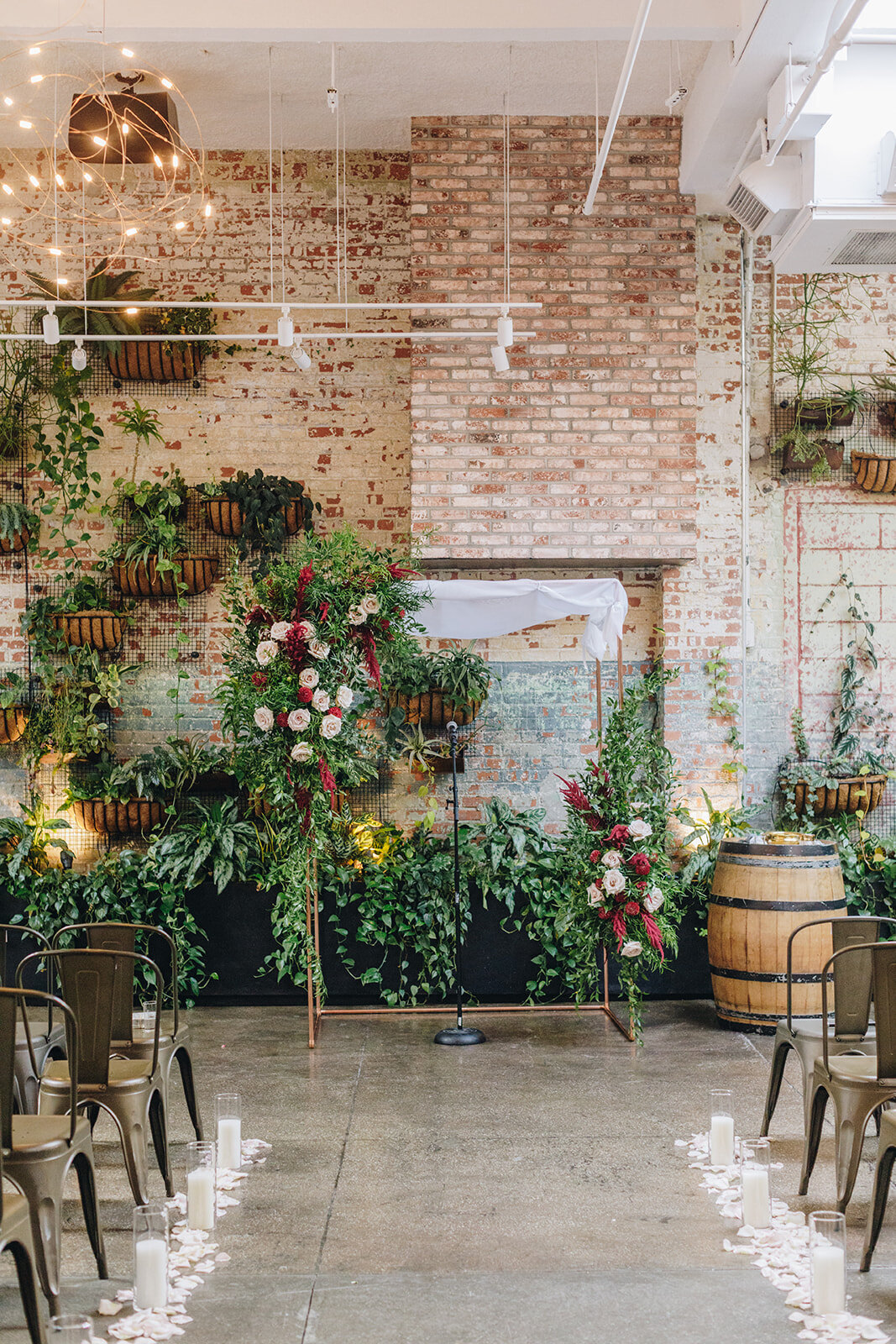 wedding ceremony space decorated with flowers from Lucy's Flowers at brooklyn Winery 