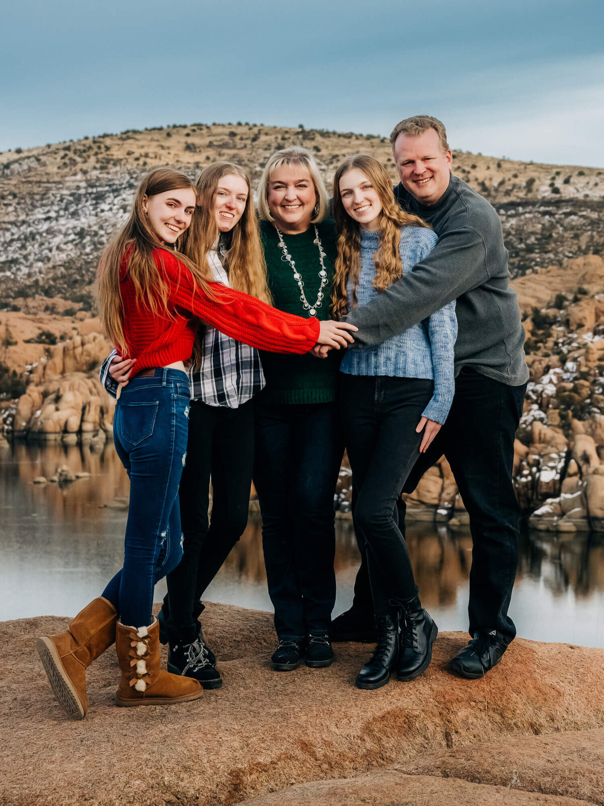 Family shares a hug at Watson Lake for Prescott family photographer Melissa Byrne