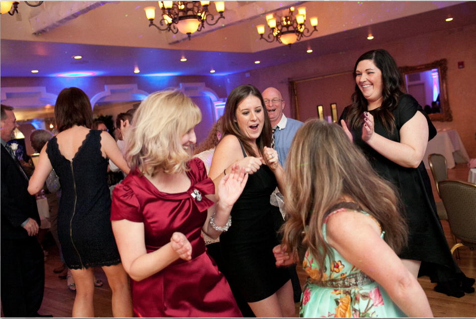 Girls getting down Dancing to DJ Music with Lighting effects