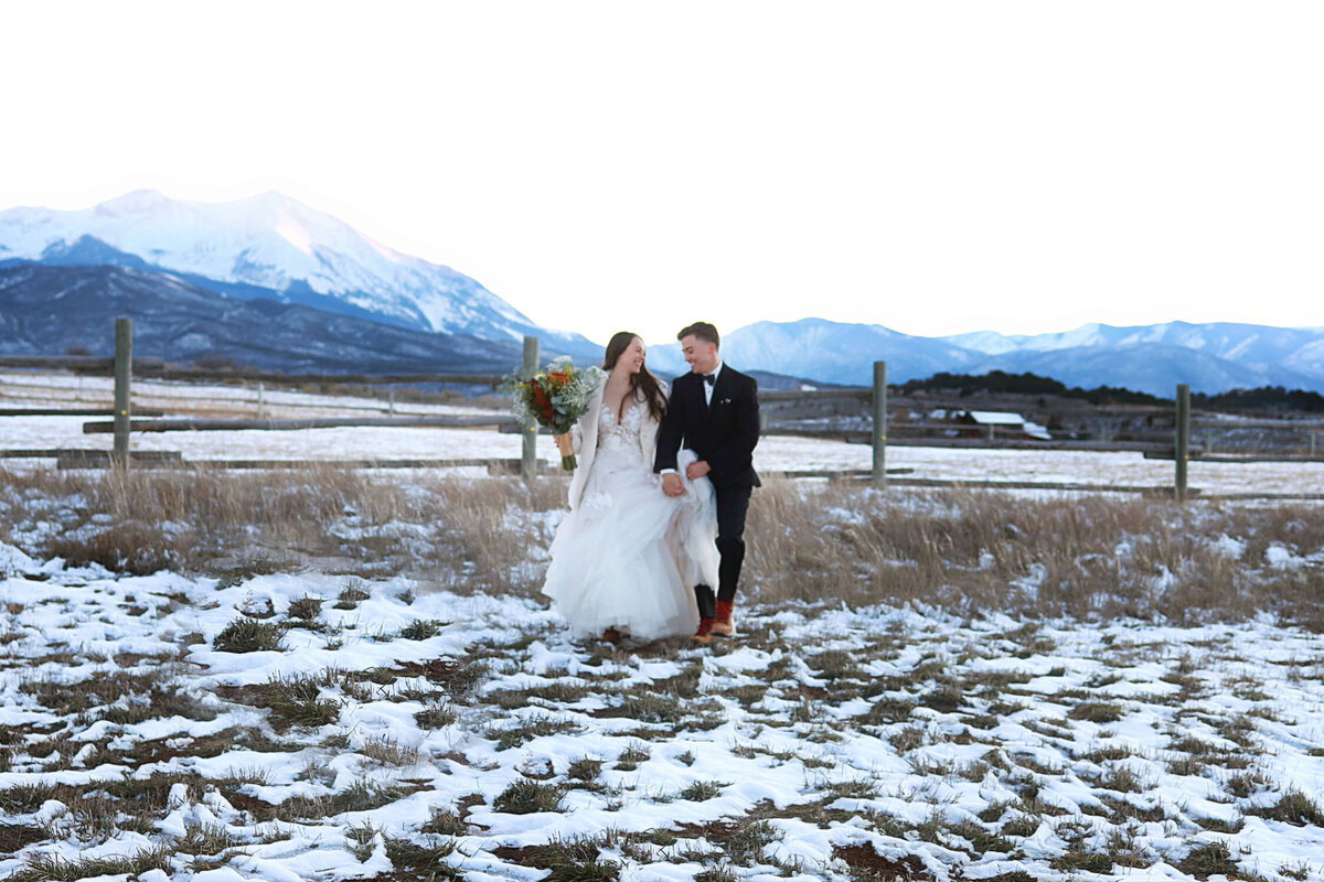 A couple just married, on a snowy day in Aspen, Colorado,