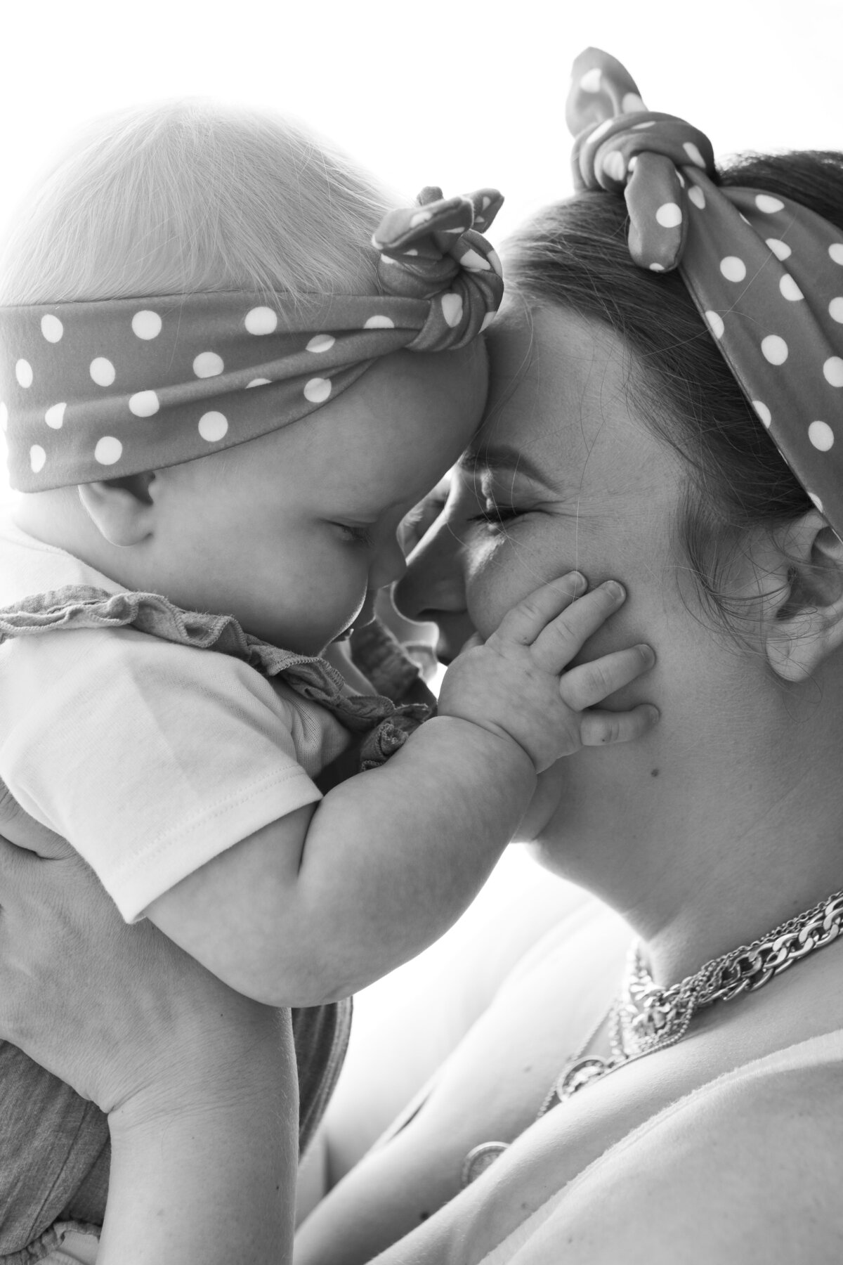 Mom and daughter backlit black and white