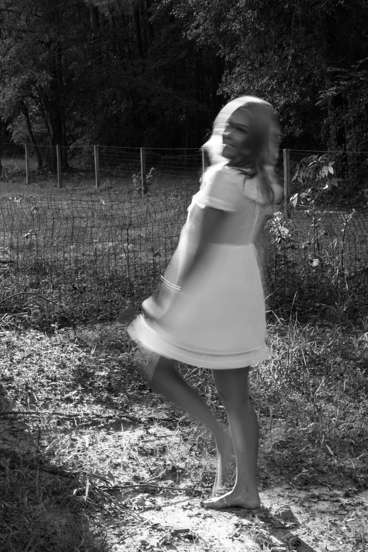 Black and white senior photos at family property