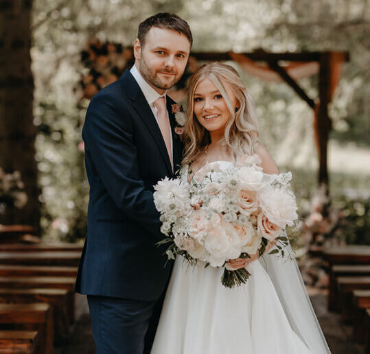 bride and groom smiling