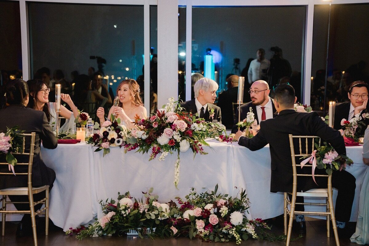 Couples table with flowers on the top and on the bottom