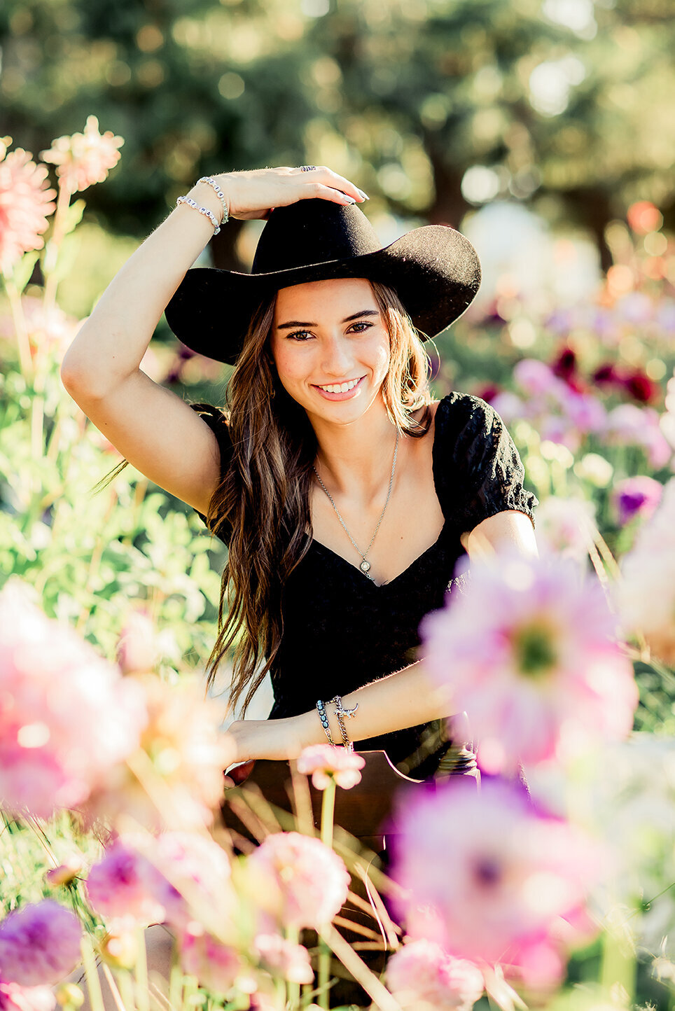 senior girl in hat with flowers