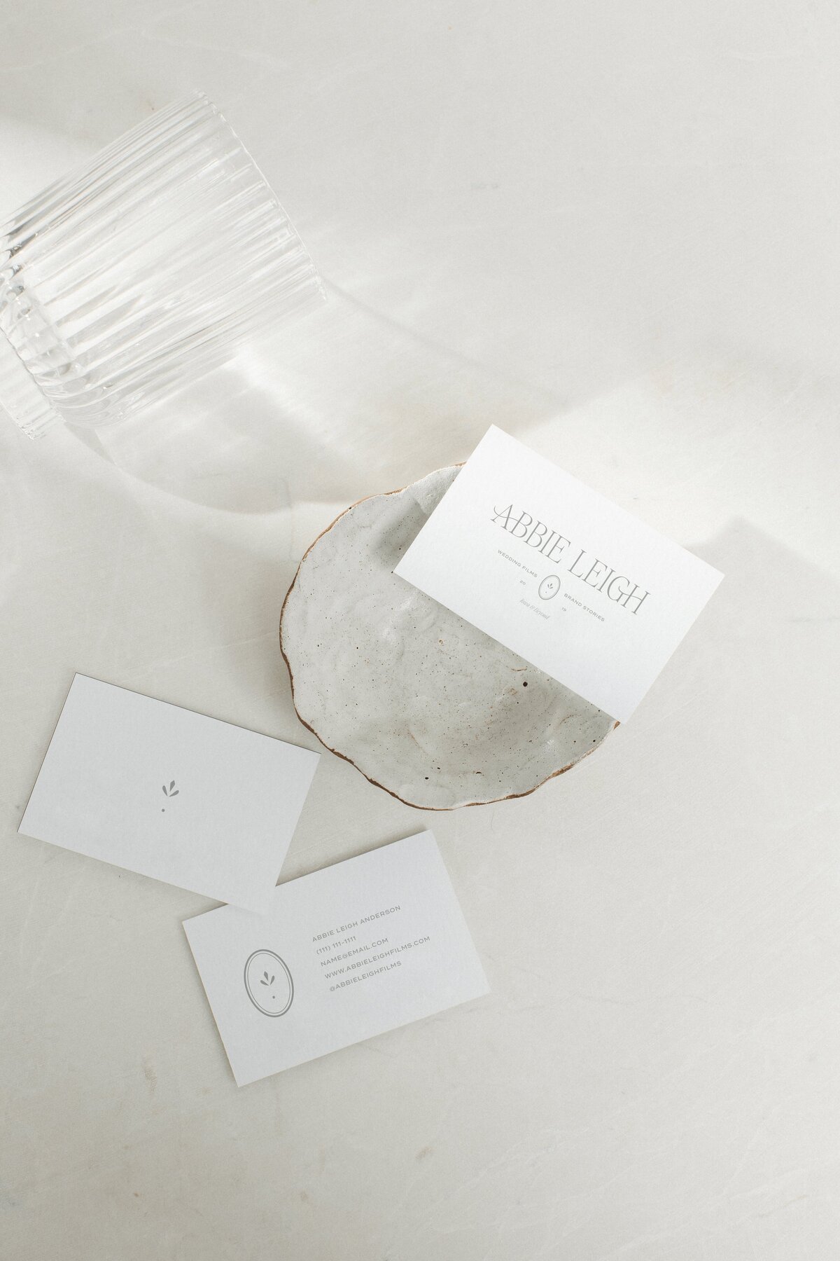 Wedding videographer logo on white business cards