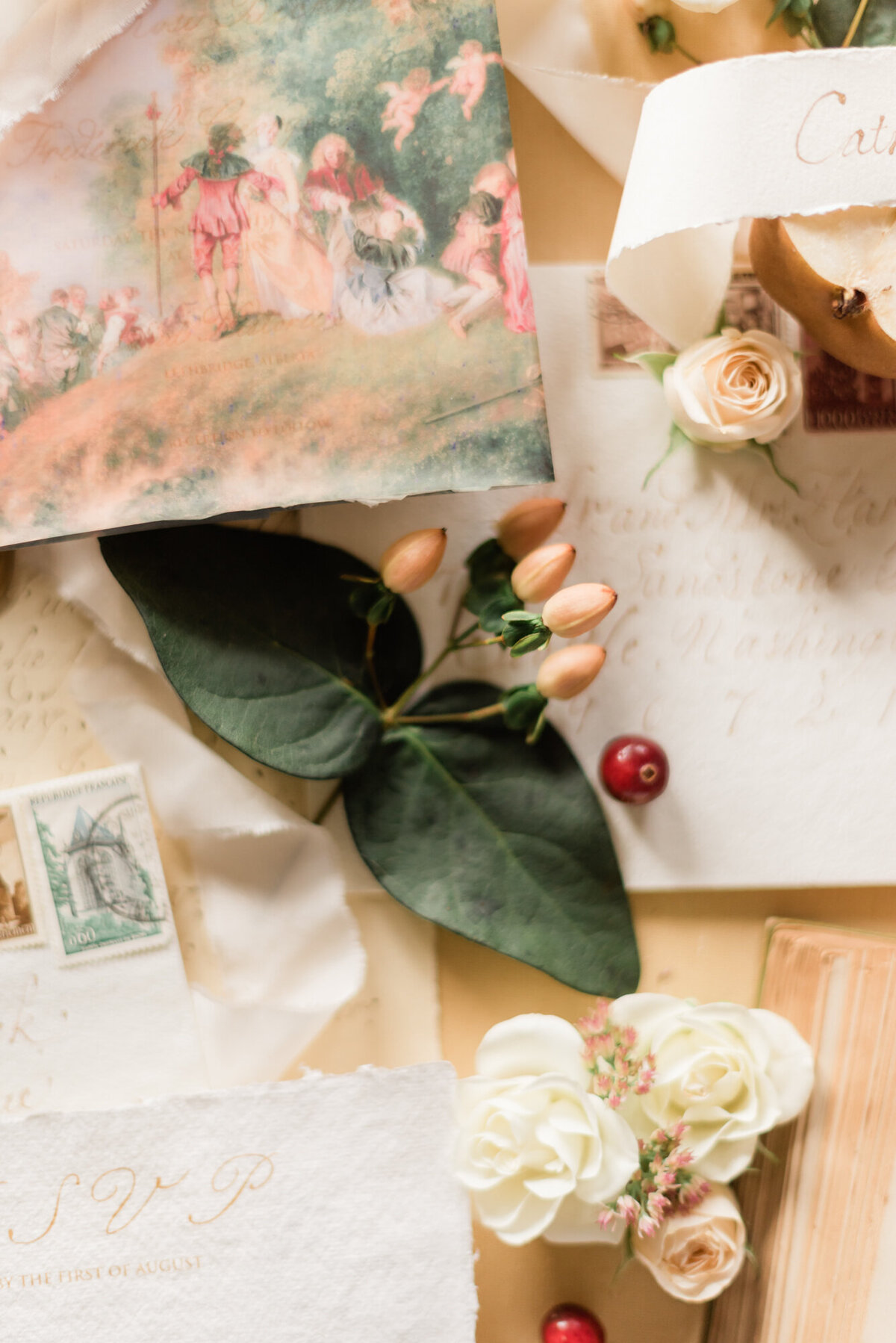 Romantic wedding stationery and details flatlay, styled by Wedding Stylist Rebekah Bronte, featuring vintage style wedding stationery and details, fruit, florals, and tones of honey, berry, green and brown. 