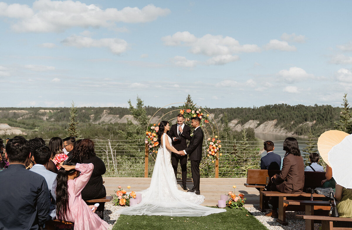 Colourful summer wedding at River's Edge in Devon Alberta, designed by Rebekah Brontë Designs