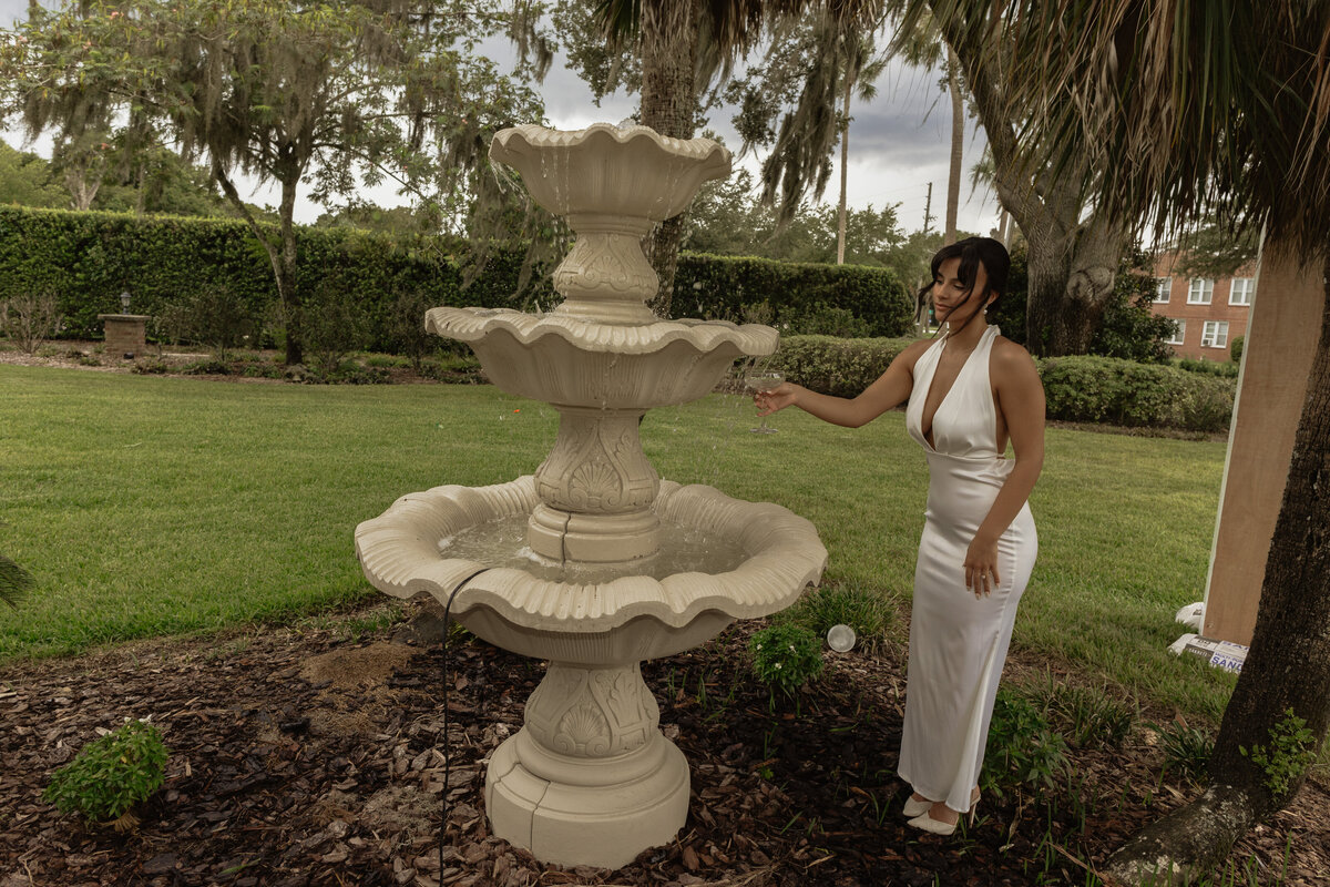 Luxury Florida wedding surrounded by tall palm trees and tropical details at The Palm Mansion in Umatilla