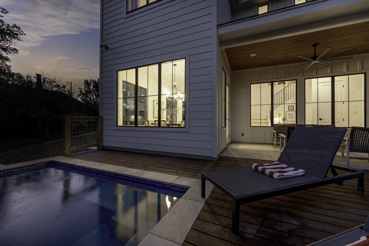wood deck next to pool