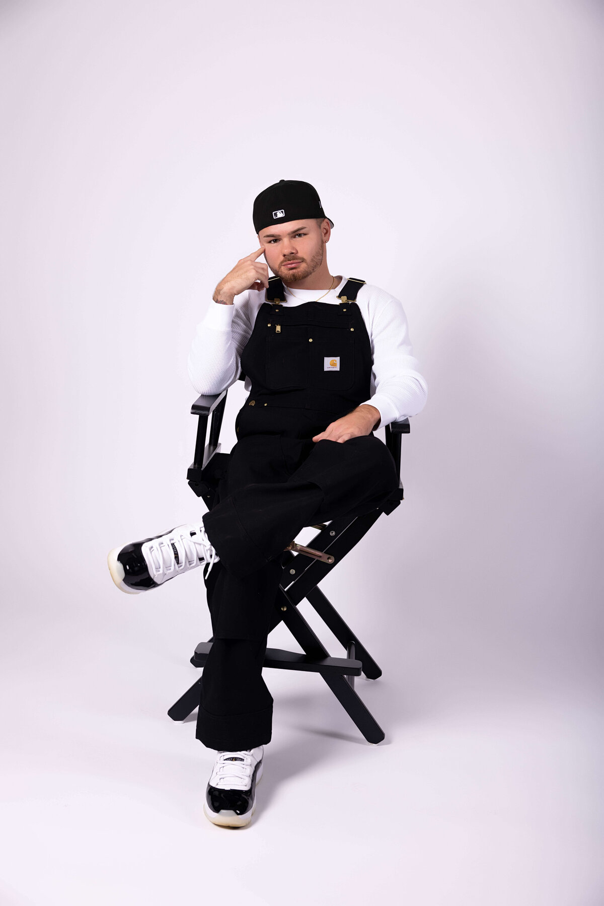 Professional boxer sitting in chair in birthday session with Reva Davis photography