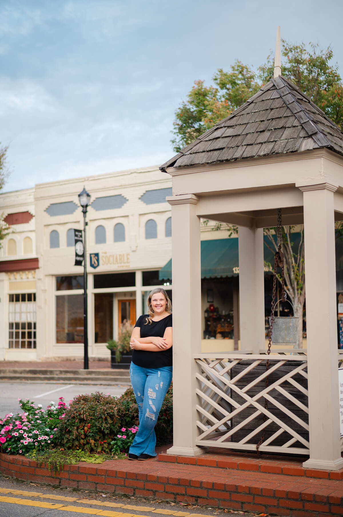 Social Circle senior stands next to the well in downtown during her senior session