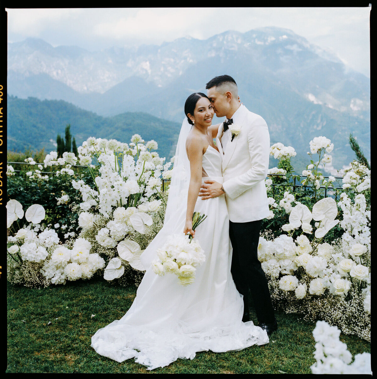 caruso-belmond-hotel-amalfi-coast-ravello-wedding-02-bride-groom-floral-arch-mountains-jenny-fu-studio
