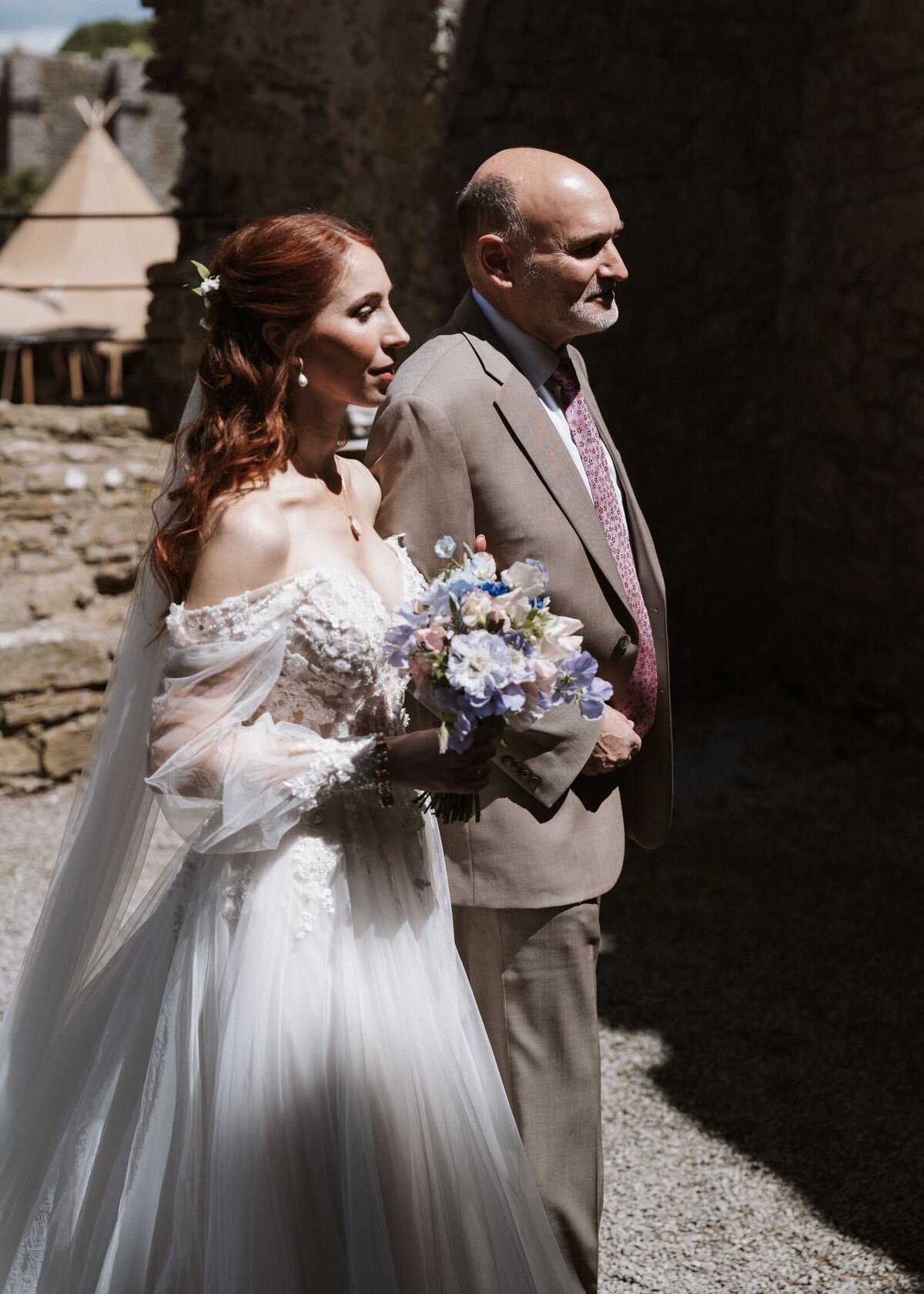 Daughter and dad having a moment together before walking down the aisle