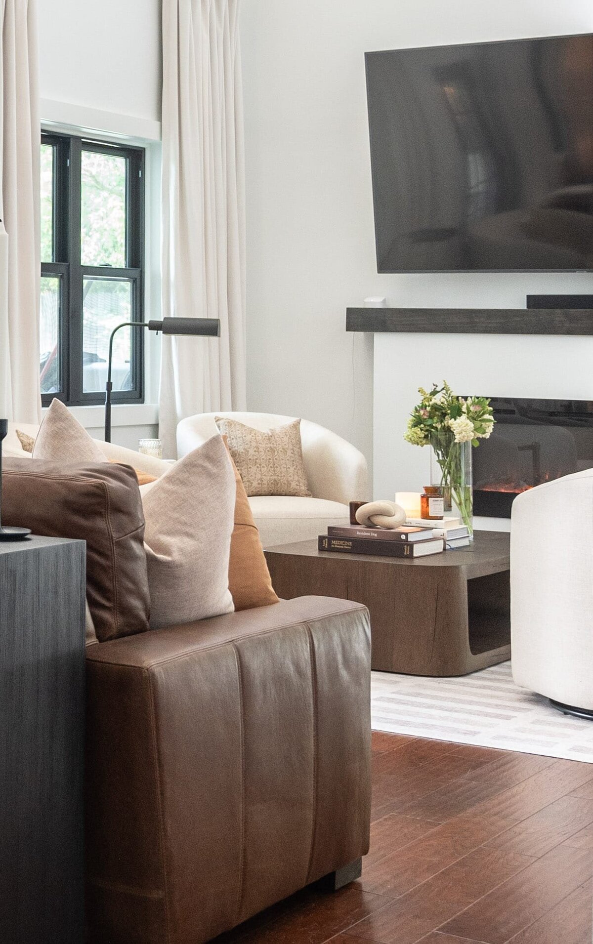 dewine design orlando interior design farmhouse modern living room with wooden coffee table and leather couch