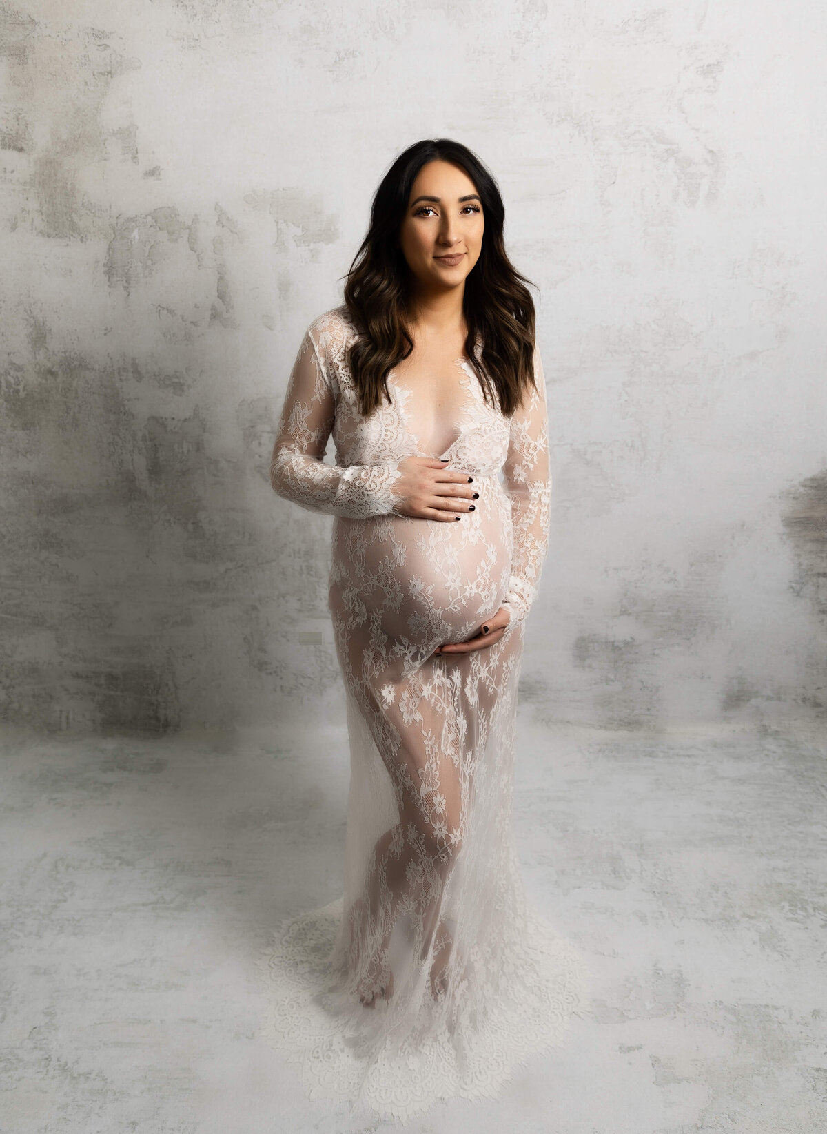 Erie Pa photography studio maternity photo of a girl in a lace dress