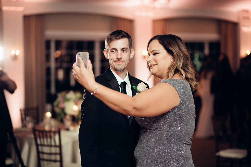Wedding Photograph Of Woman in Gray Dress And Groom In Black Suit Taking a Selfie Los Angeles