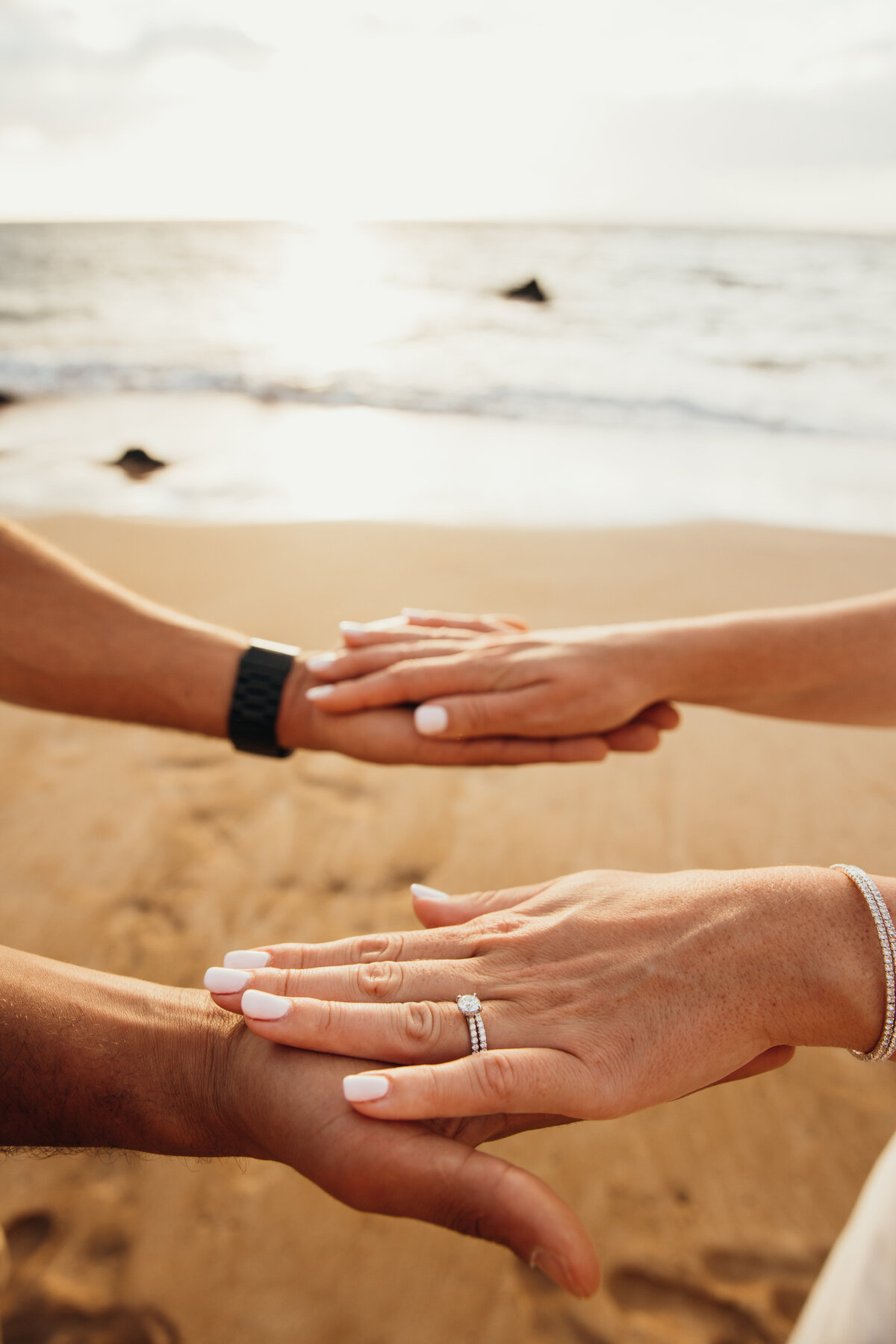 Maui Wedding Photographer captures bride's hands on groom's hands