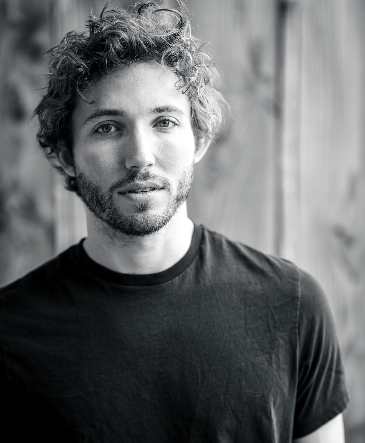 Close-up black and white image of a tech start-up executive looking serious
