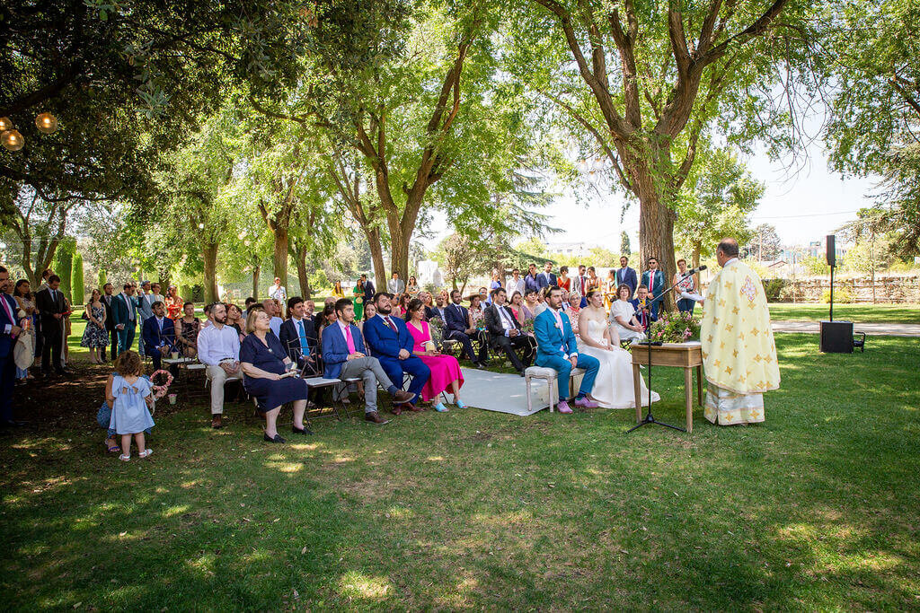 Summer time wedding at Casa De Monico.  Guests all seated on lawn watching wedding