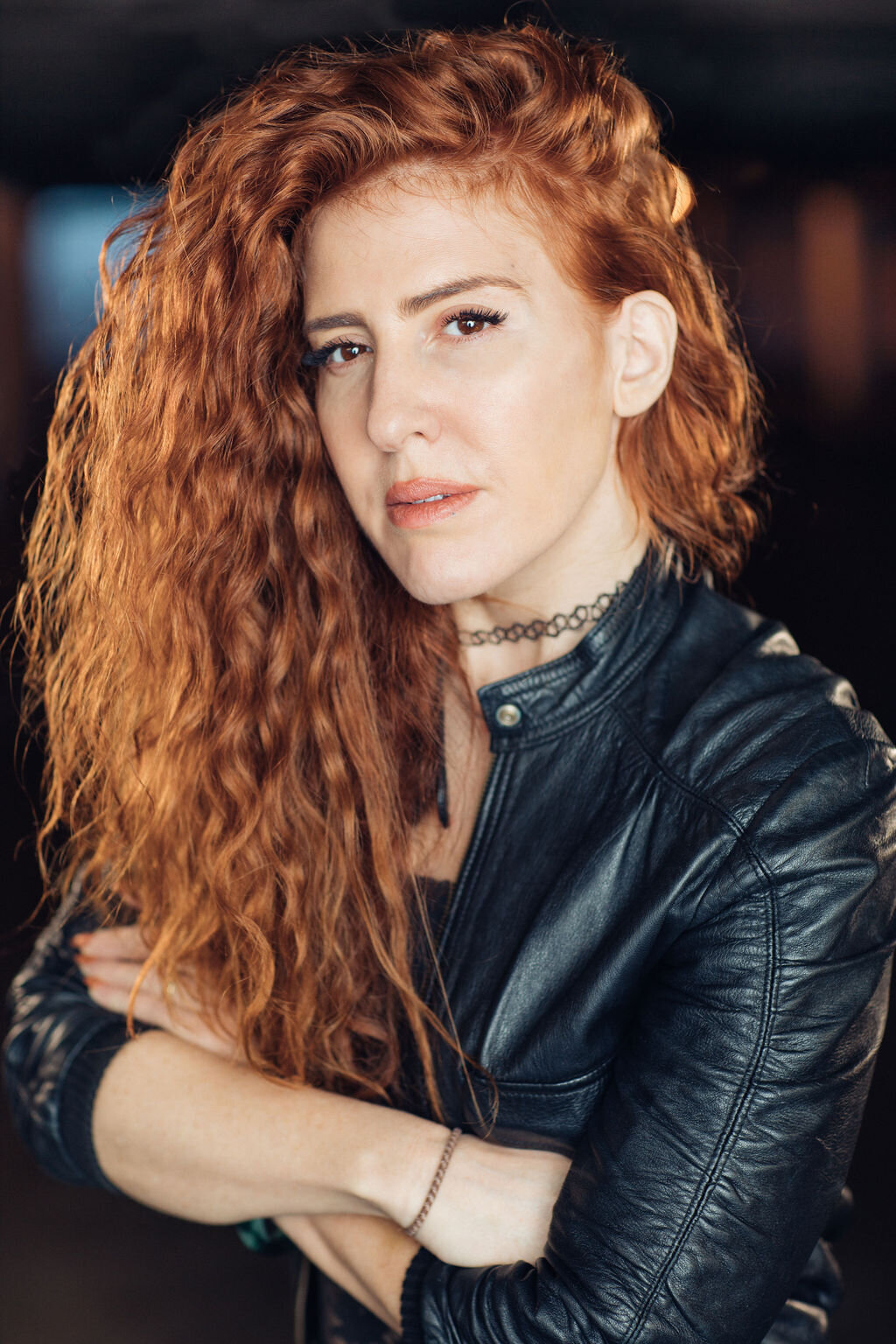 Headshot Photograph Of Woman In Outer Black Leather Jacket And Inner Black Shirt Los Angeles
