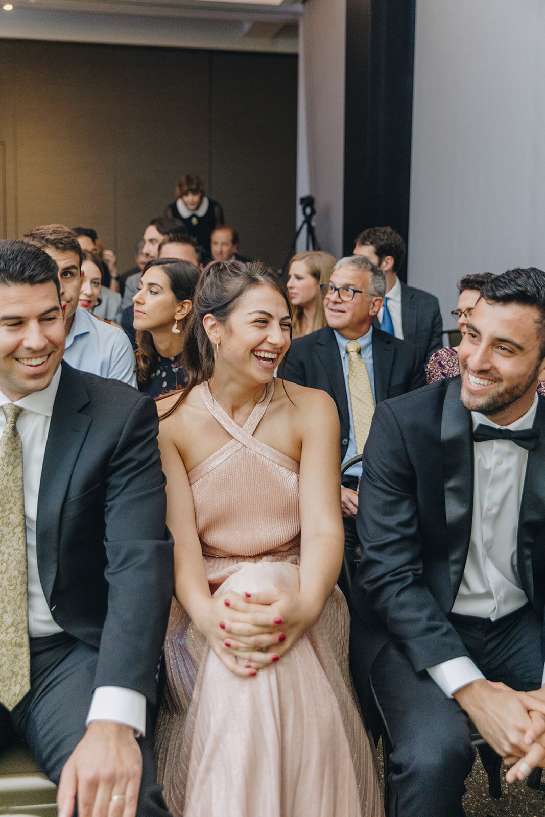 guest in audience at wedding ceremony