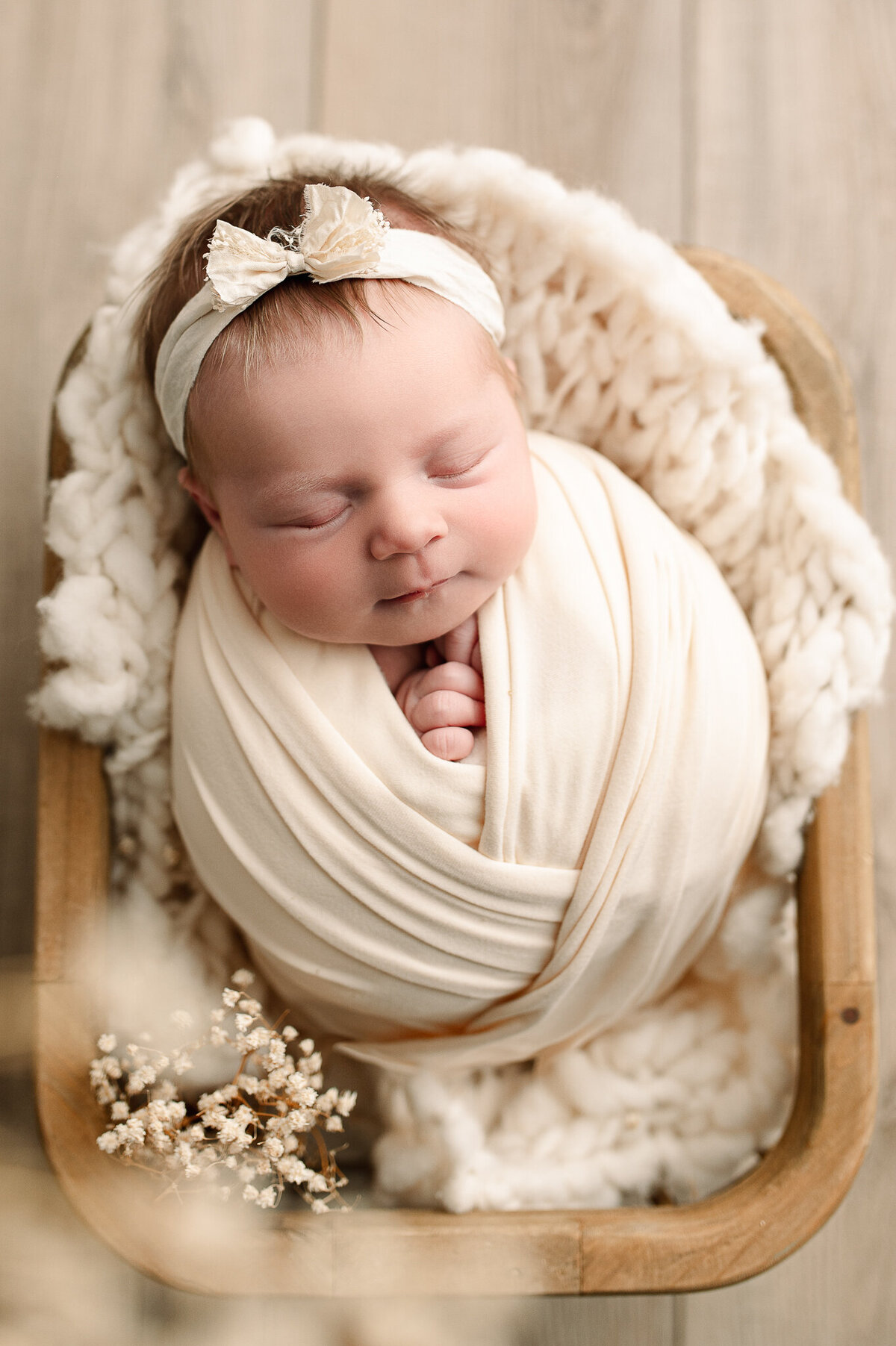 Ivory swaddled newborn luxury natural light photography