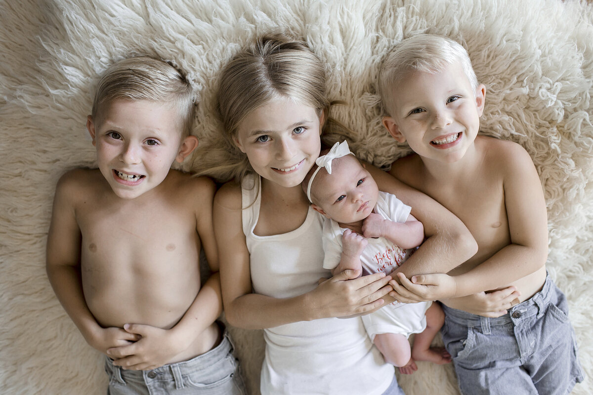 Siblings with new baby sister