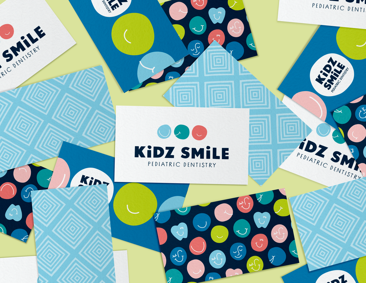 Colorful and bold patterned business card designs for Kidz Smile Pediatric Dentistry. Designed by Pace Creative Design Studio