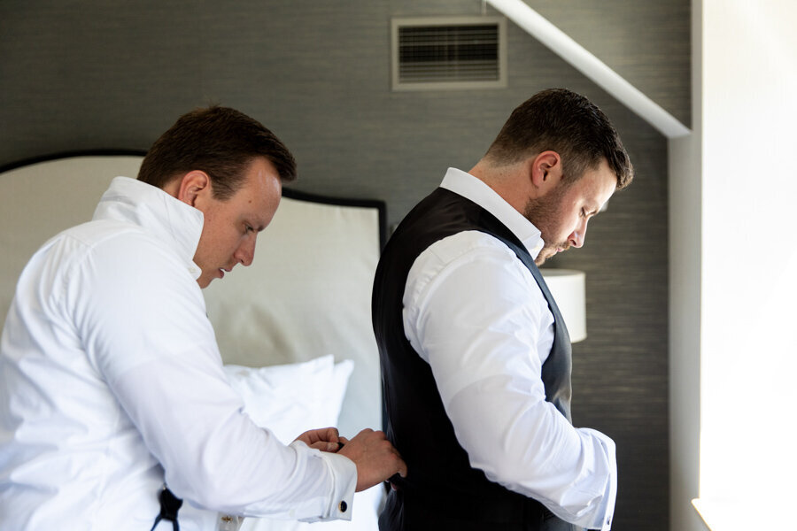 groom-getting-dressed-intercon-hotel-chicago