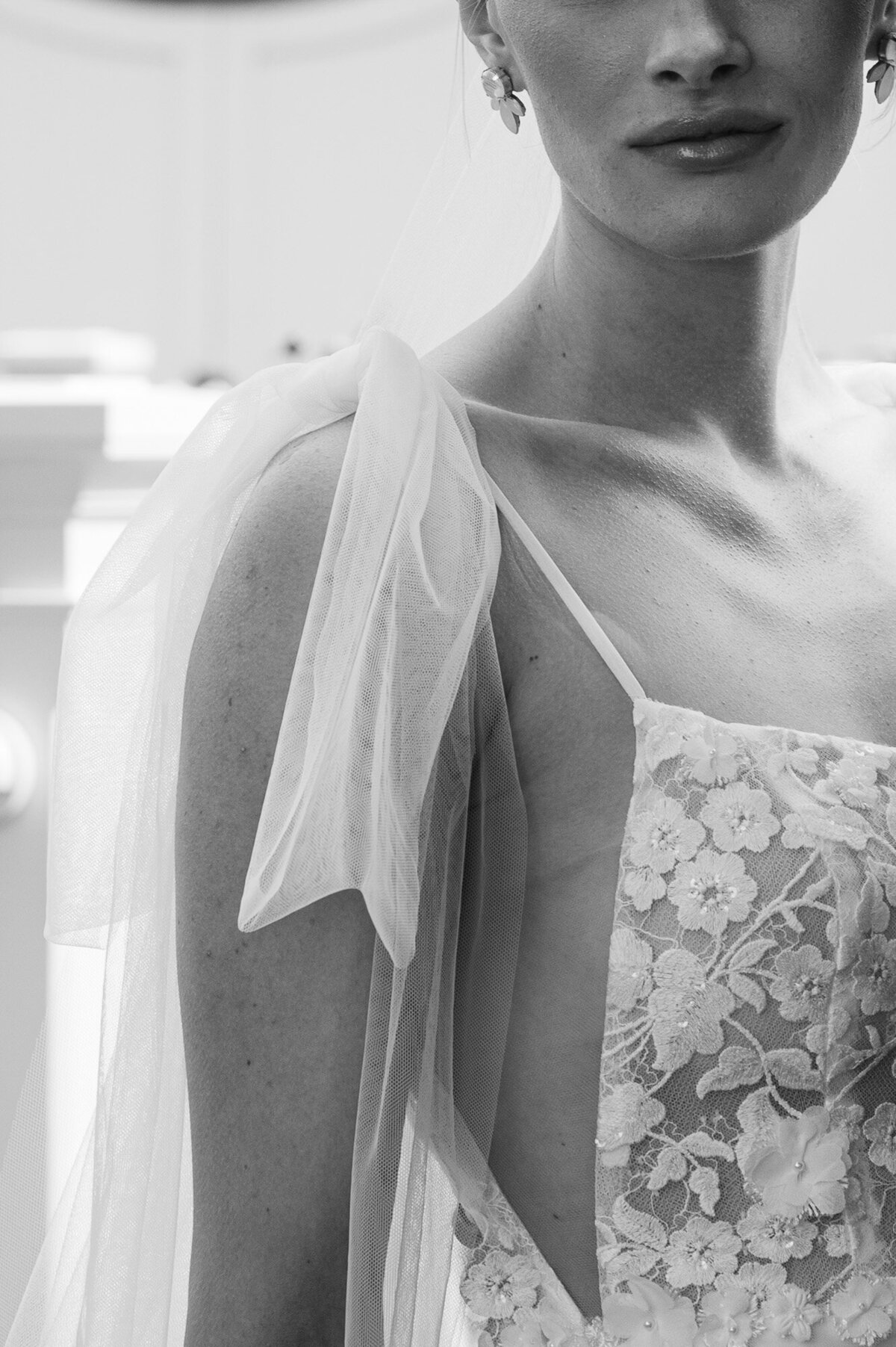 close up of the sheer arm of a wedding dress