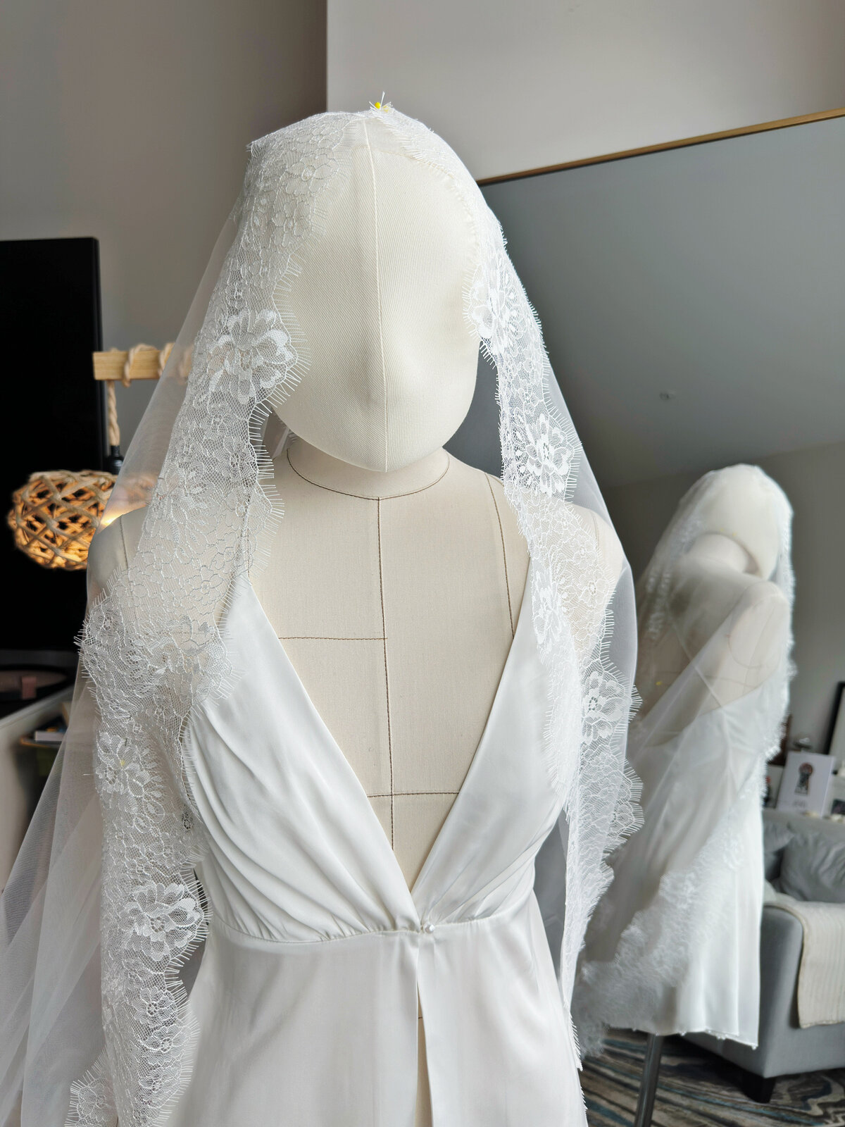 Close-up view of lace detailing on handmade mantilla veil