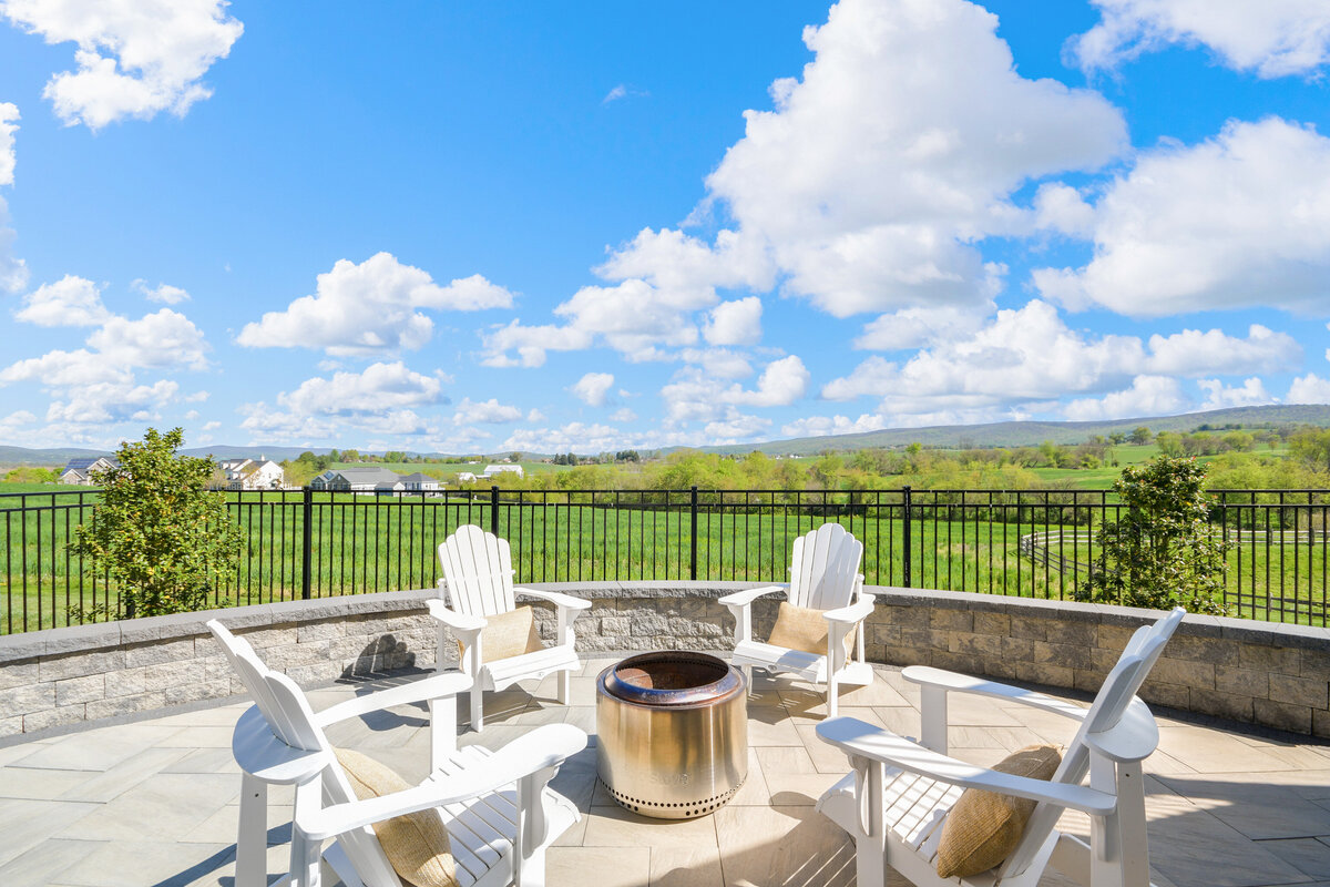 Backyard Fire Pit with white chairs