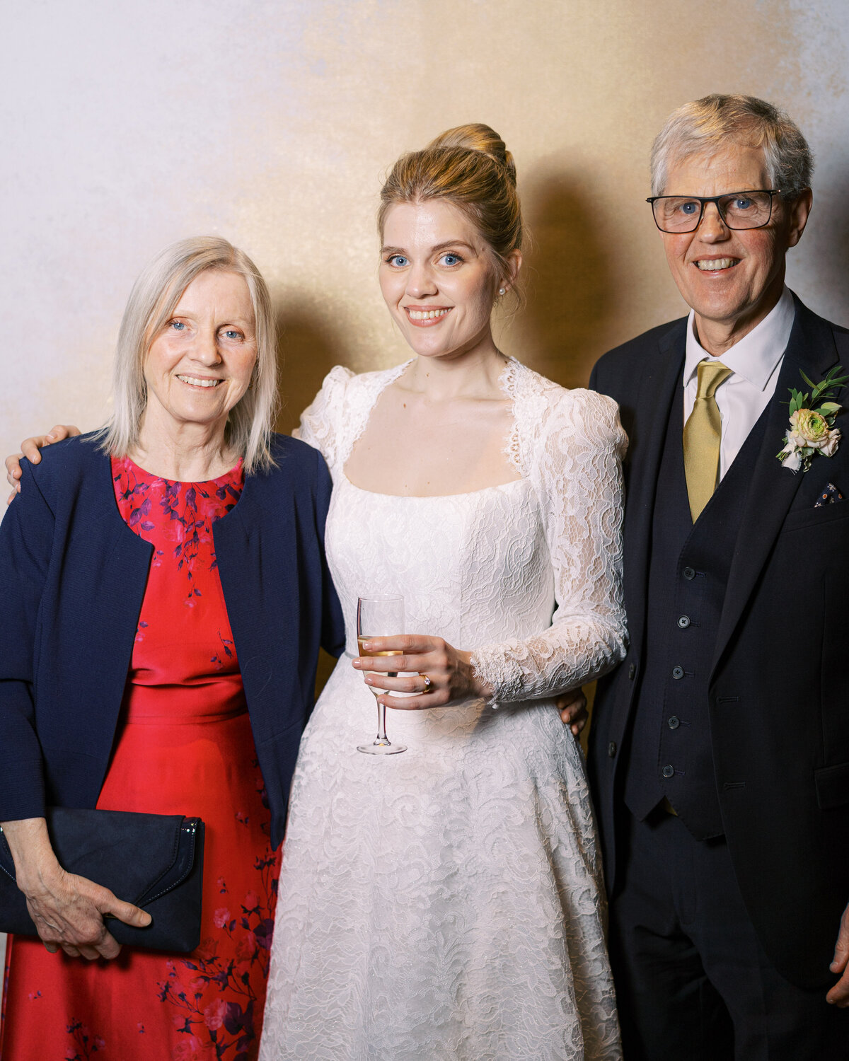 Bride and parents in wedding portrait studio wedding photobooth