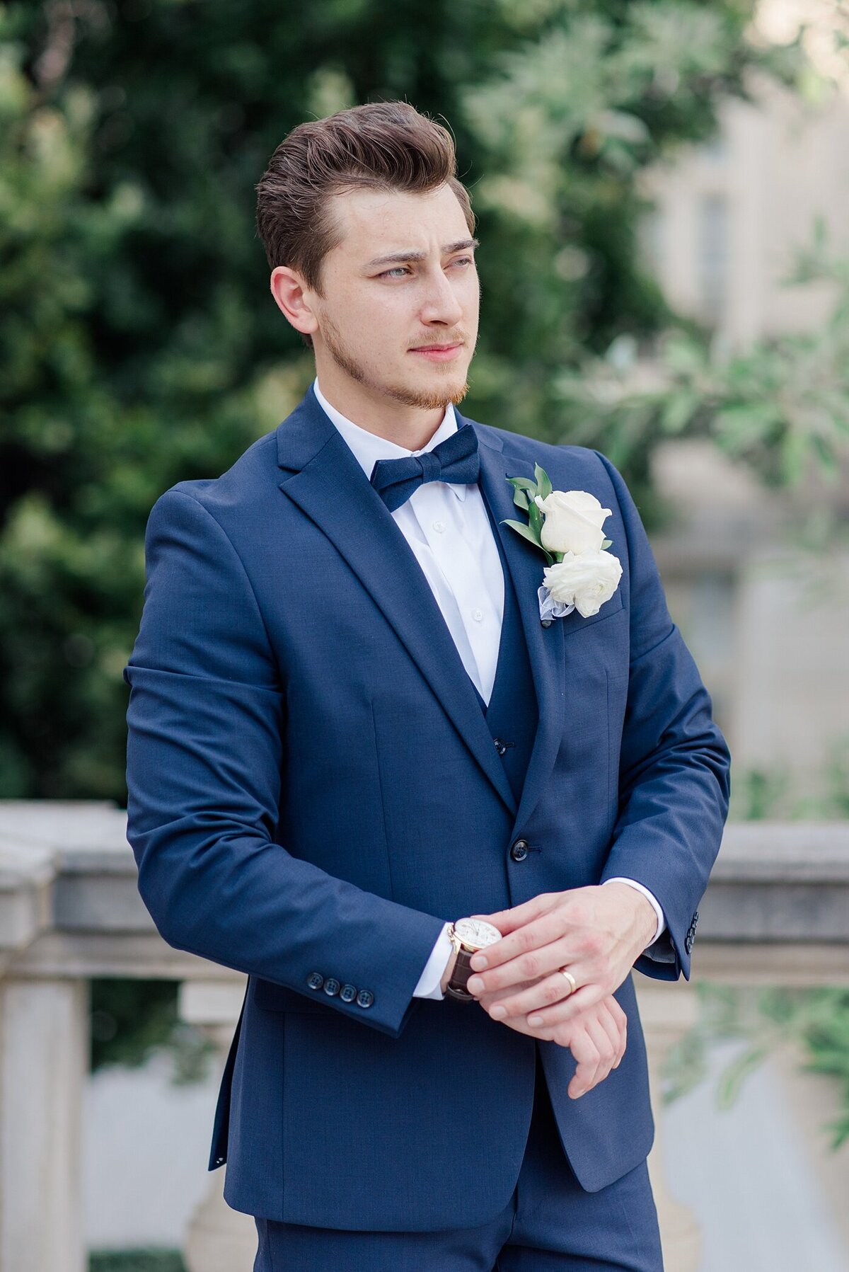 Groom posing in downtown Columbus, Ohio taken by Ohio Wedding Photographer