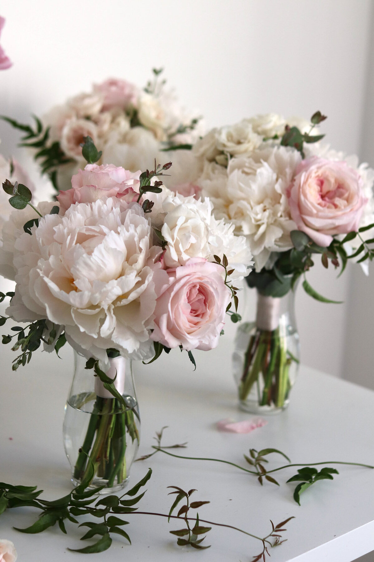 In the floral design studio with bridesmaid bouquets.