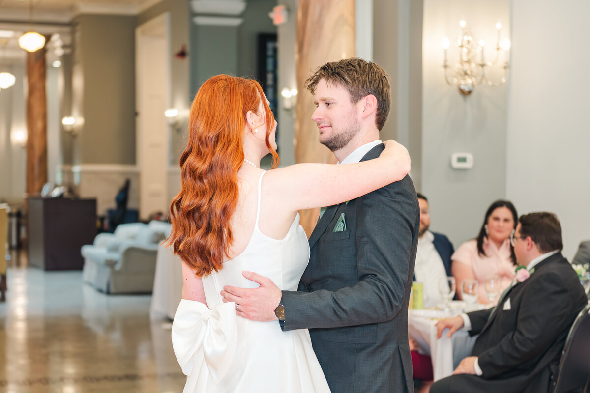 bride and groom in their reception space enjoying their first dance in lexington