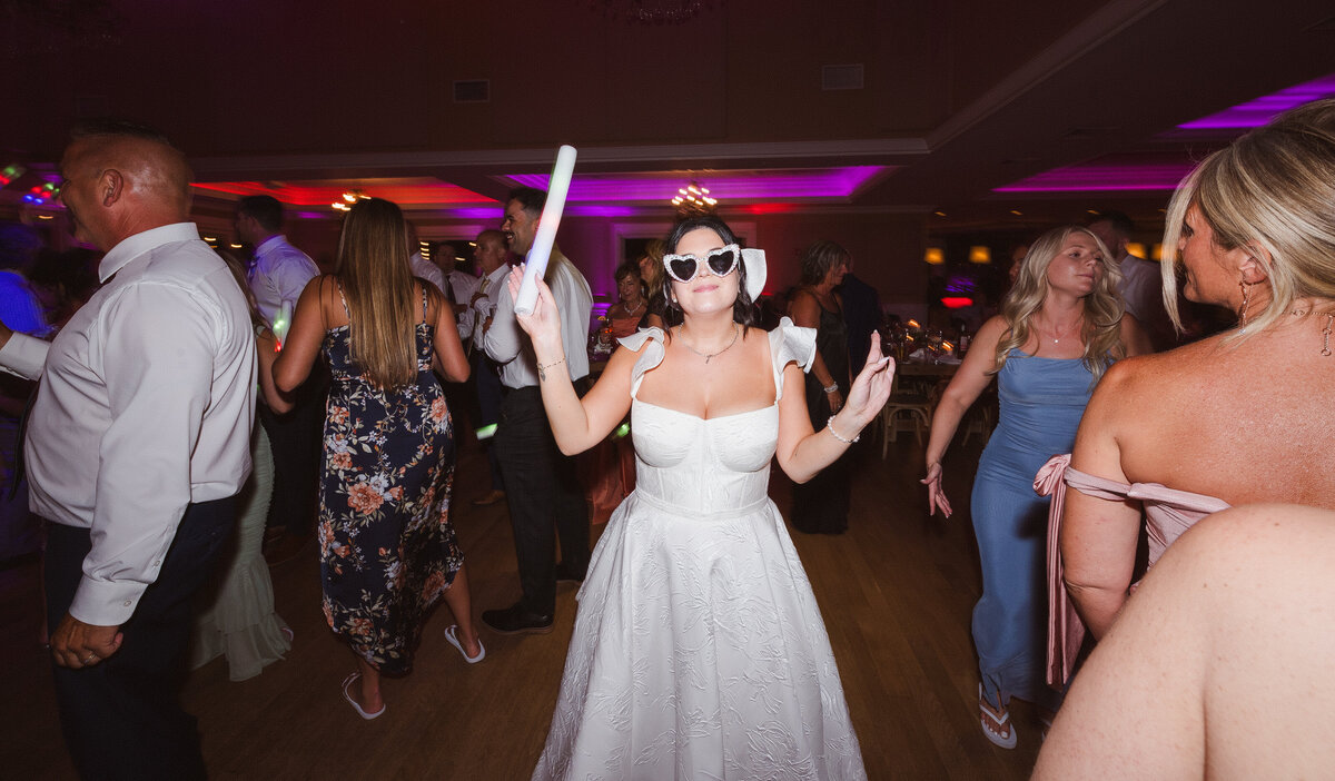 bride wearing sunglasses on the dance floor 