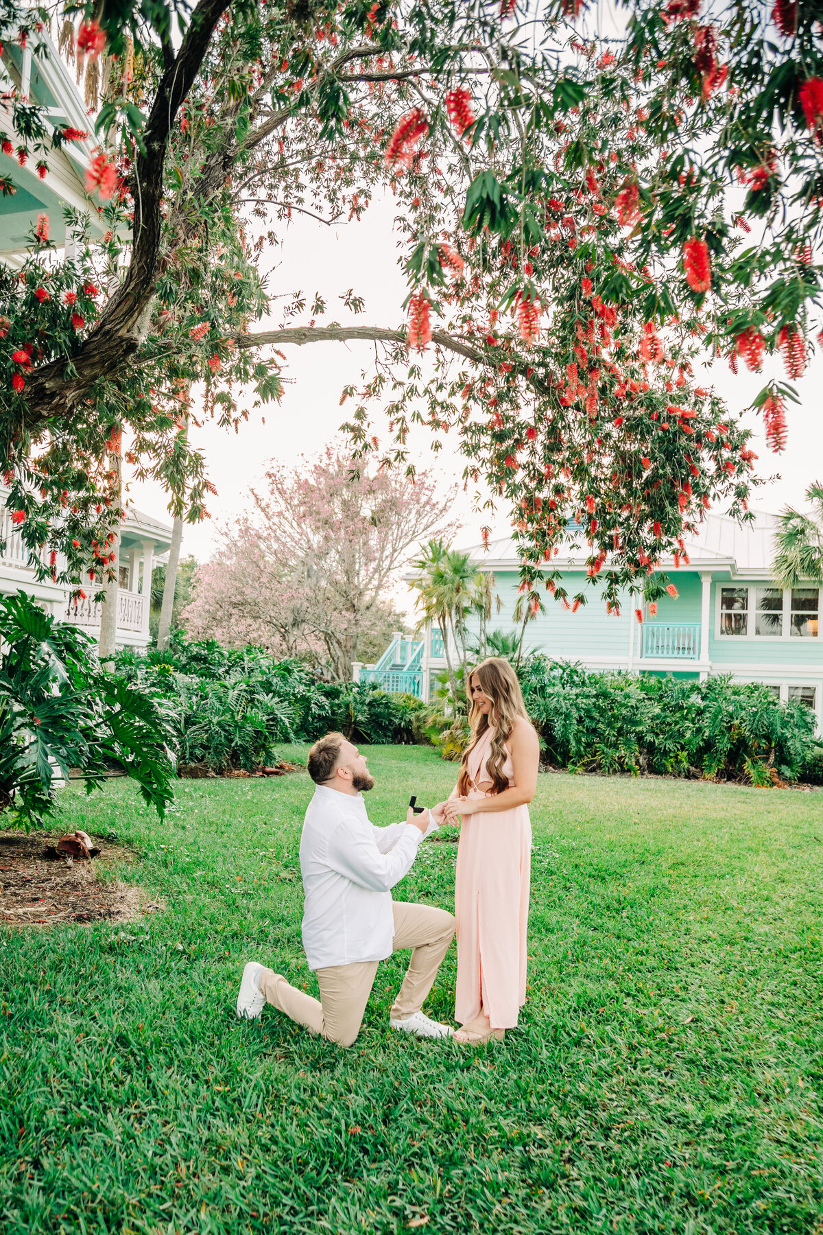 man on knee proposing during surprise proposal