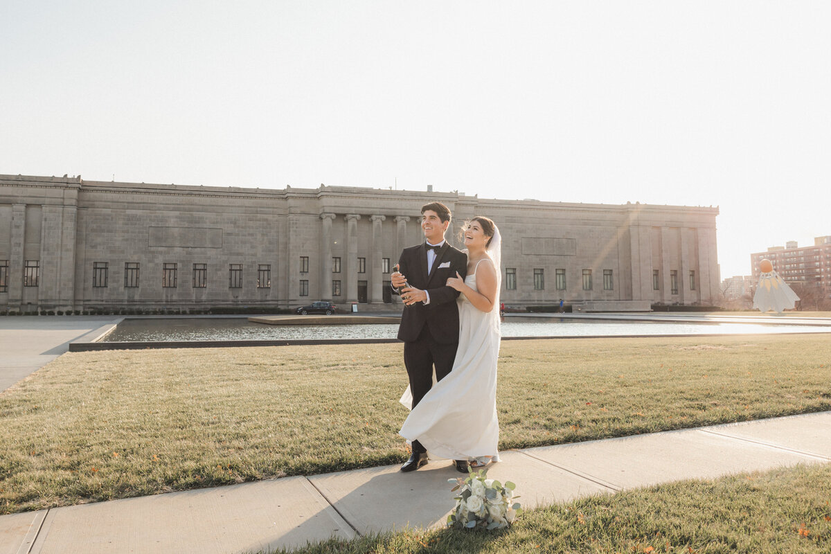 Nelson Atkins Museum. Bride & Groom Photos. Champagne photos. Golden hour sunflare. Kansas City Wedding Photography