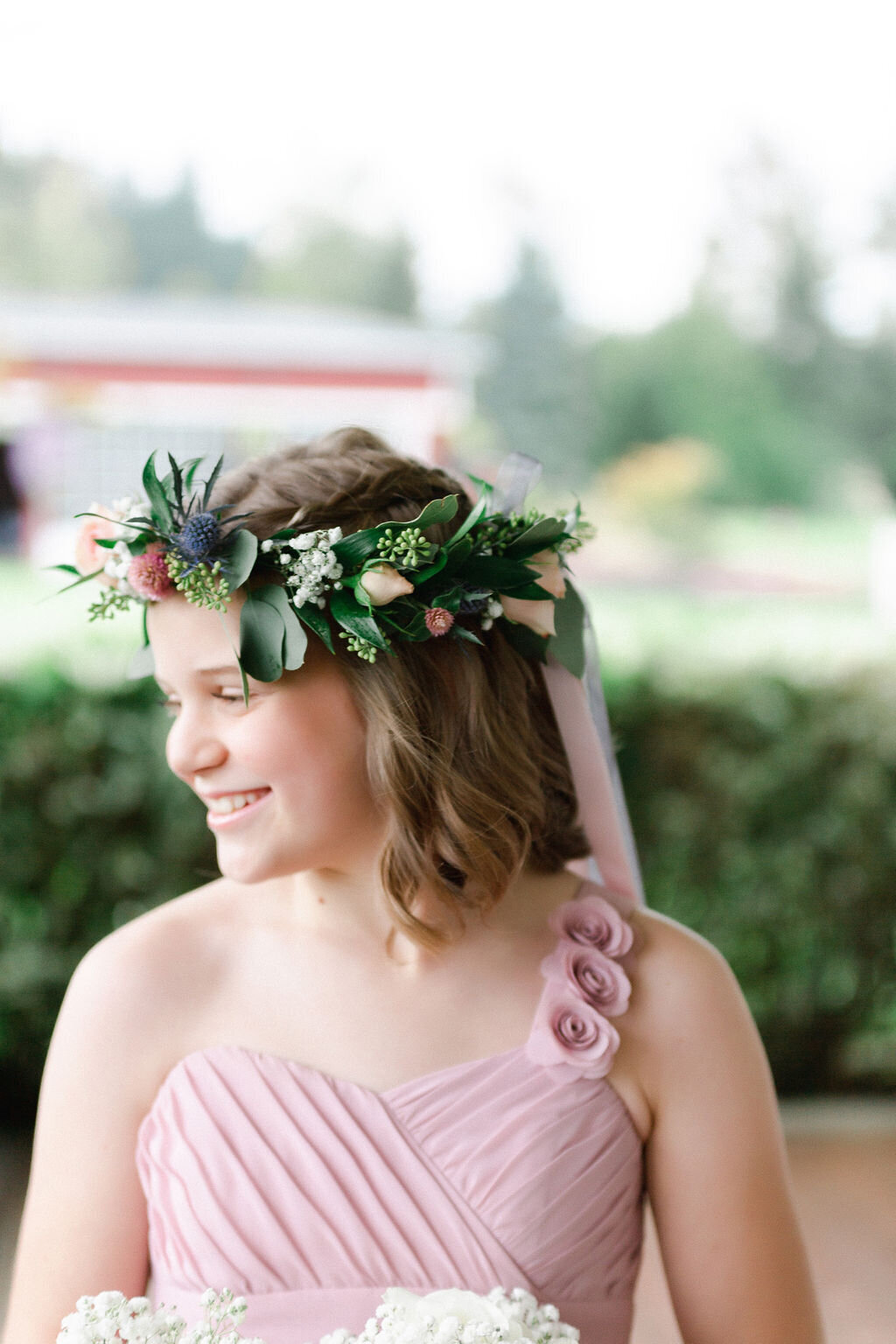 Flower crown of dusty blue and mauve pink.