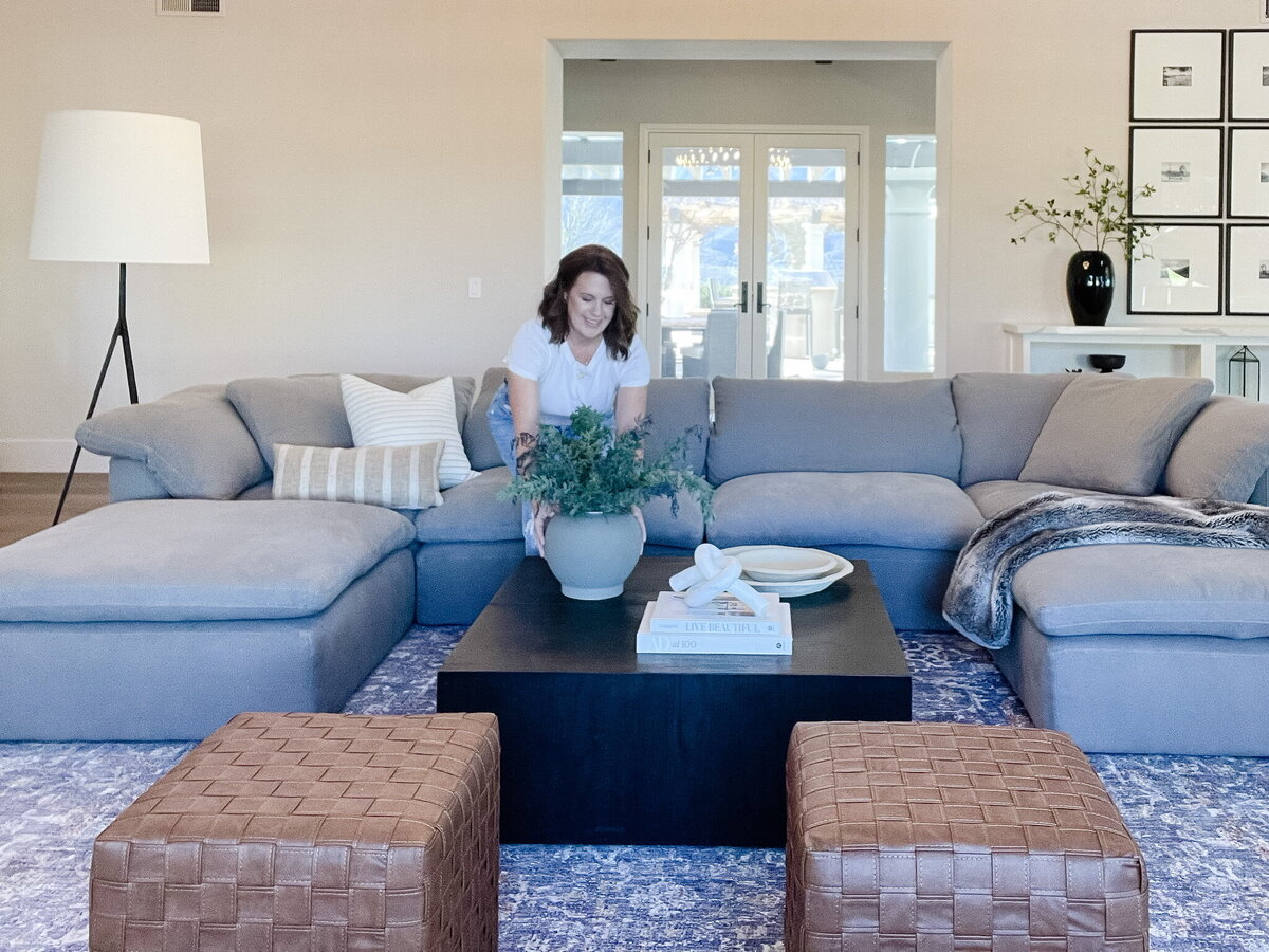 woman posing by couch
