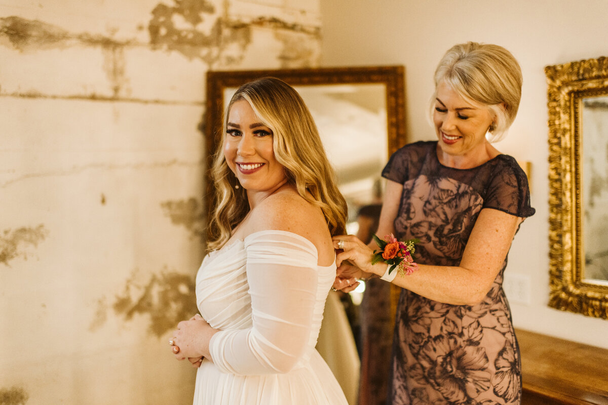Bride getting ready with mother in bridal suite at the St Vrain wedding venue in Longmont, CO